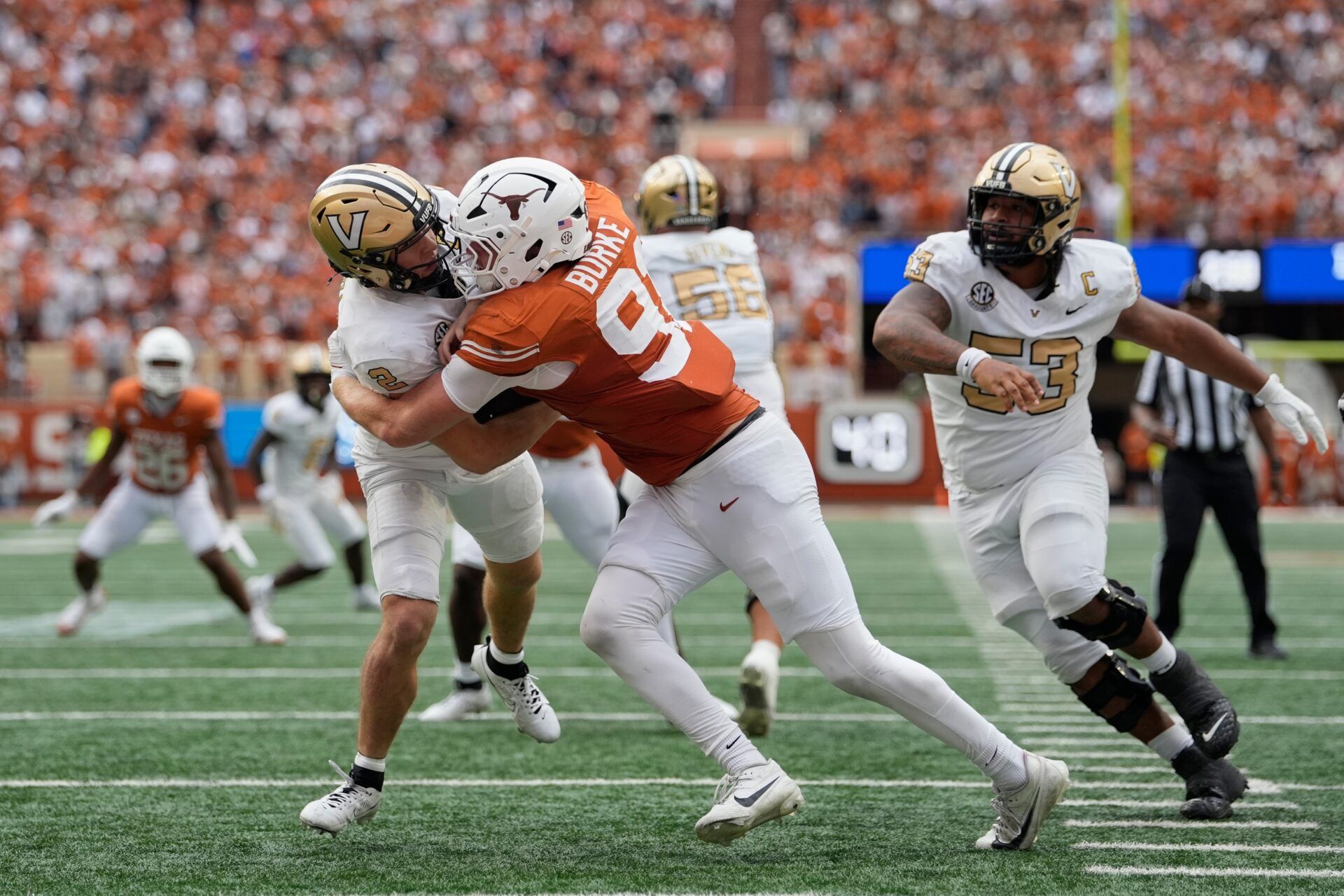 Texas Longhorns defensive lineman Ethan Burke (91) sacks Vanderbilt Commodores quarterback Diego Pavia (2) on the one yard line during the second half at Darrell K Royal-Texas Memorial Stadium.