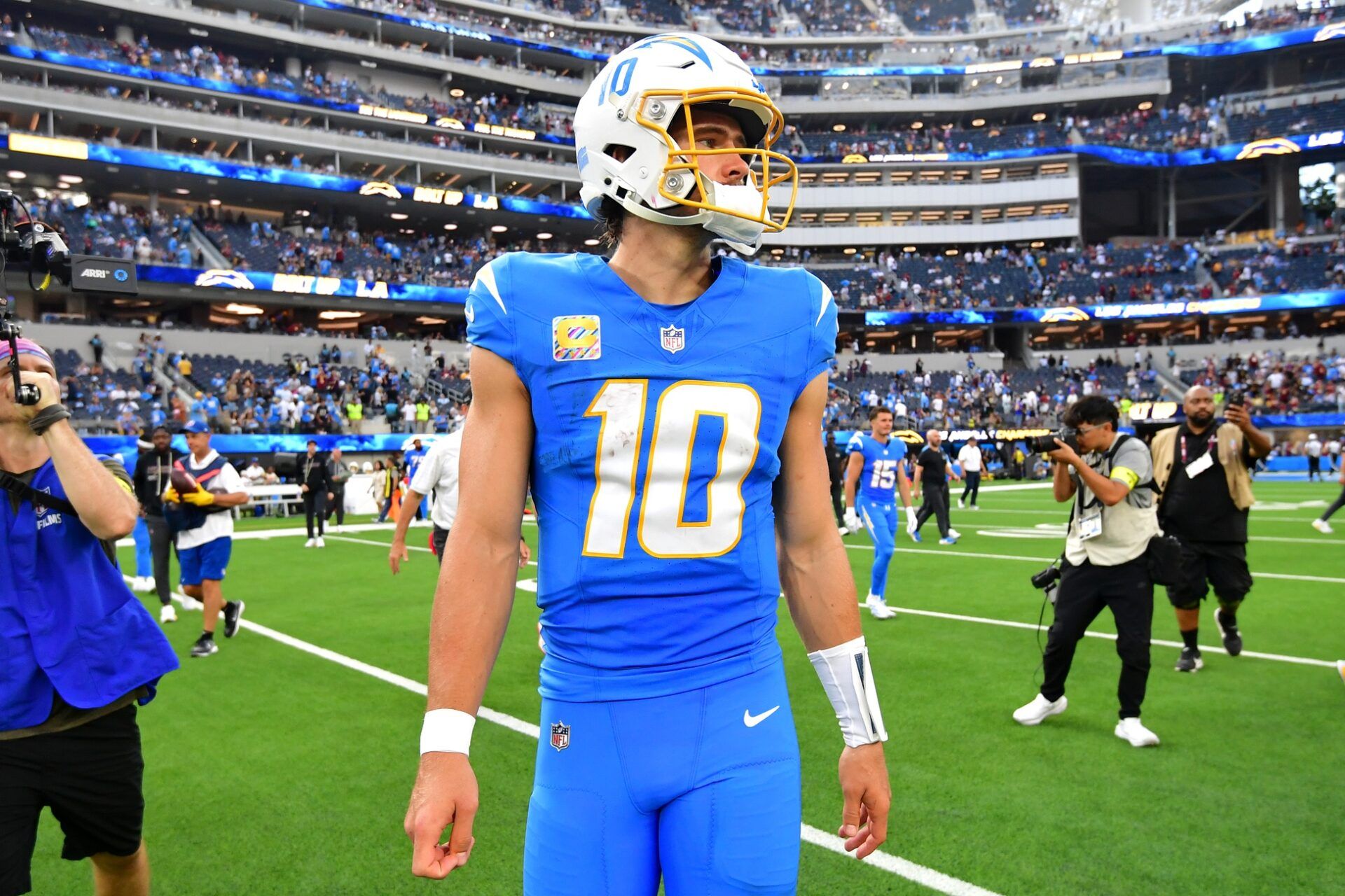 Los Angeles Chargers quarterback Justin Herbert (10) reacts after the game against the Washington Commanders at SoFi Stadium.