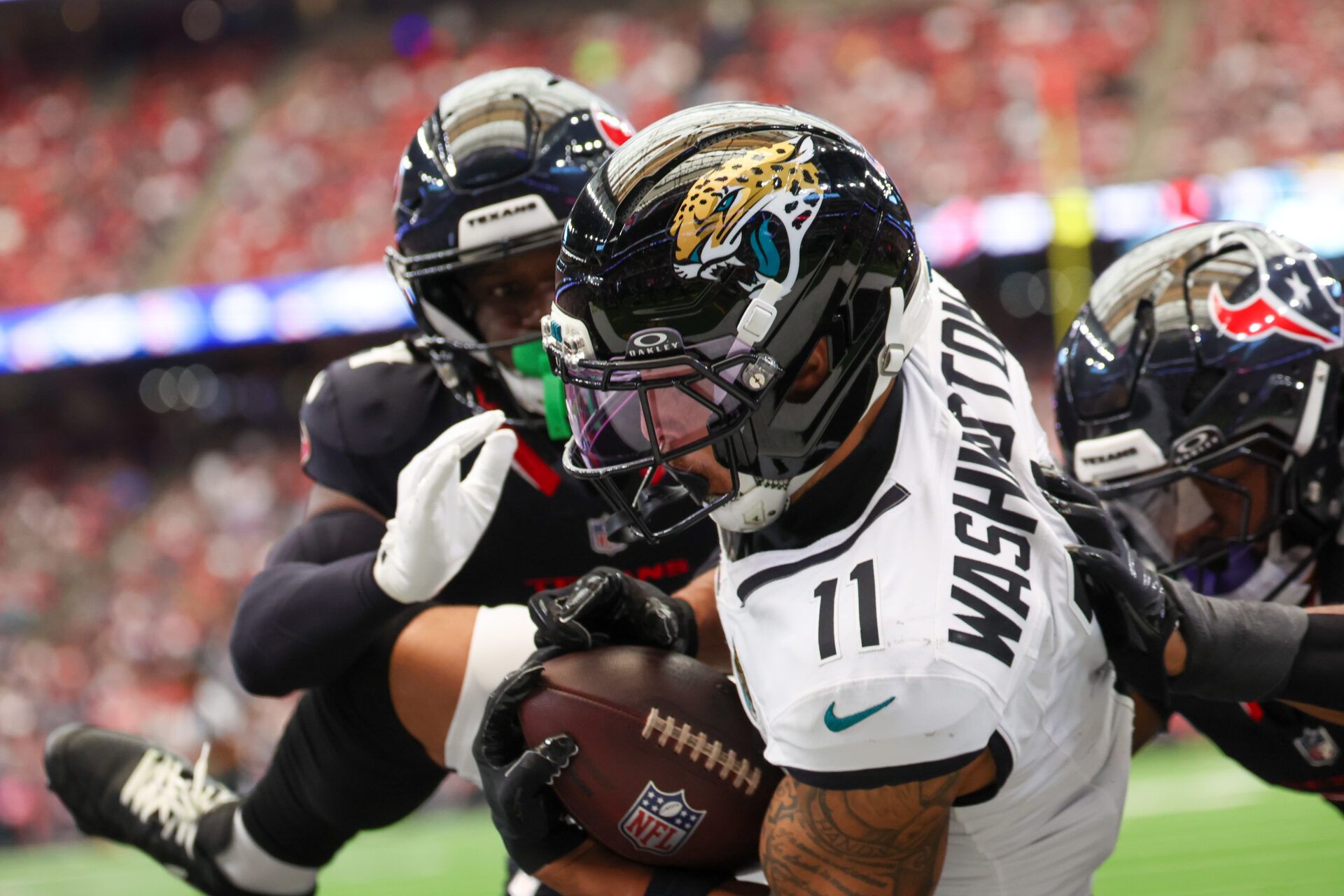 Jacksonville Jaguars wide receiver Parker Washington (11) catches a touchdown against the Houston Texans during the first half at NRG Stadium.