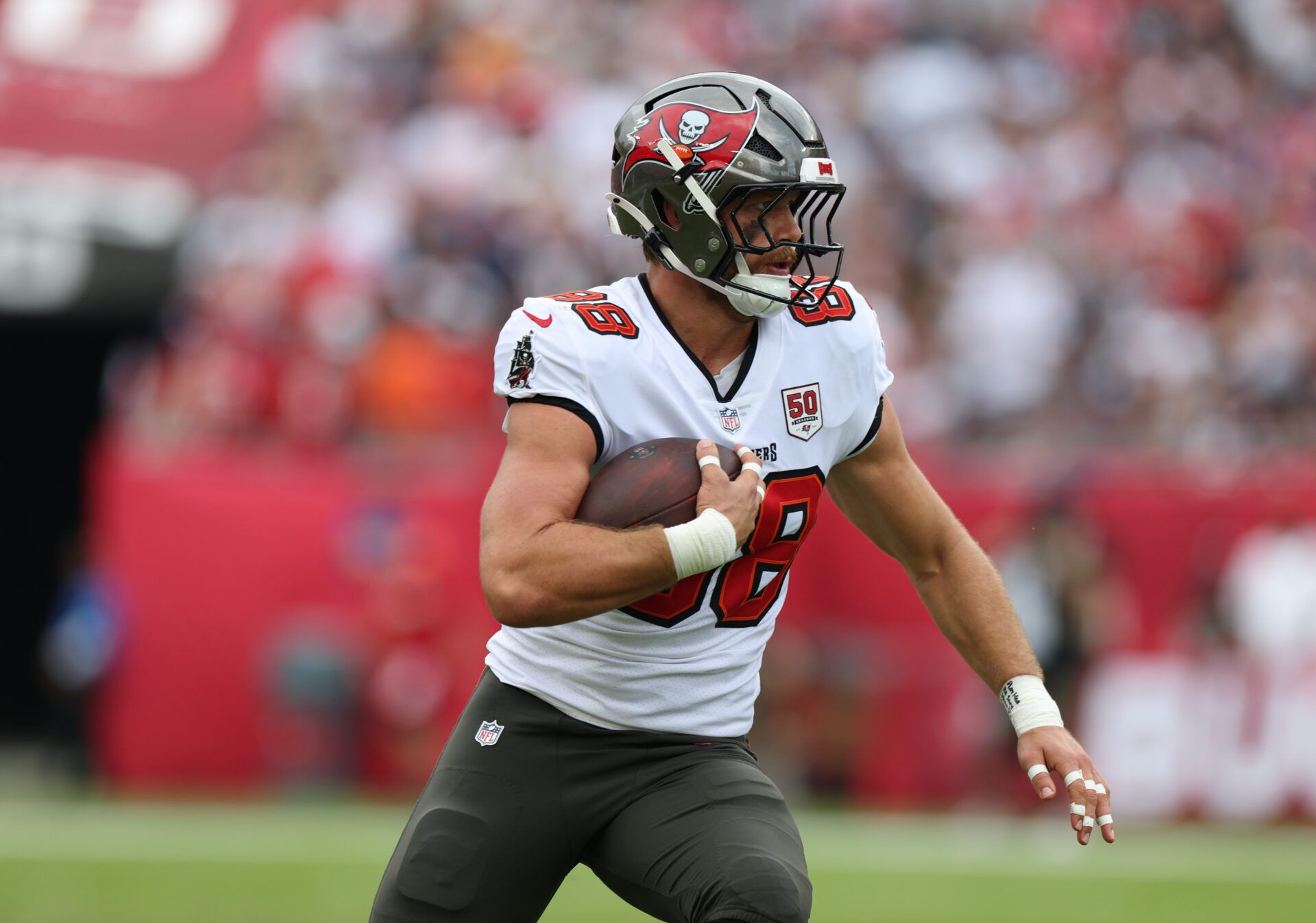 Tampa Bay Buccaneers tight end Cade Otton (88) runs for a gain during the first quarter against the New England Patriots at Raymond James Stadium.