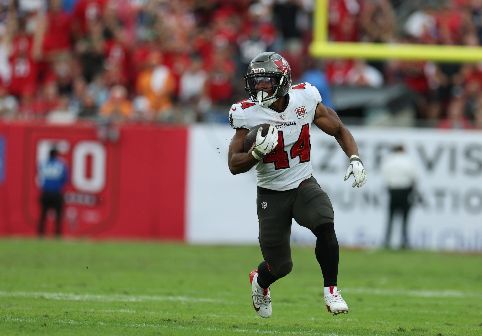 Tampa Bay Buccaneers running back Sean Tucker (44) runs for a gain during the fourth quarter against the New England Patriots at Raymond James Stadium.