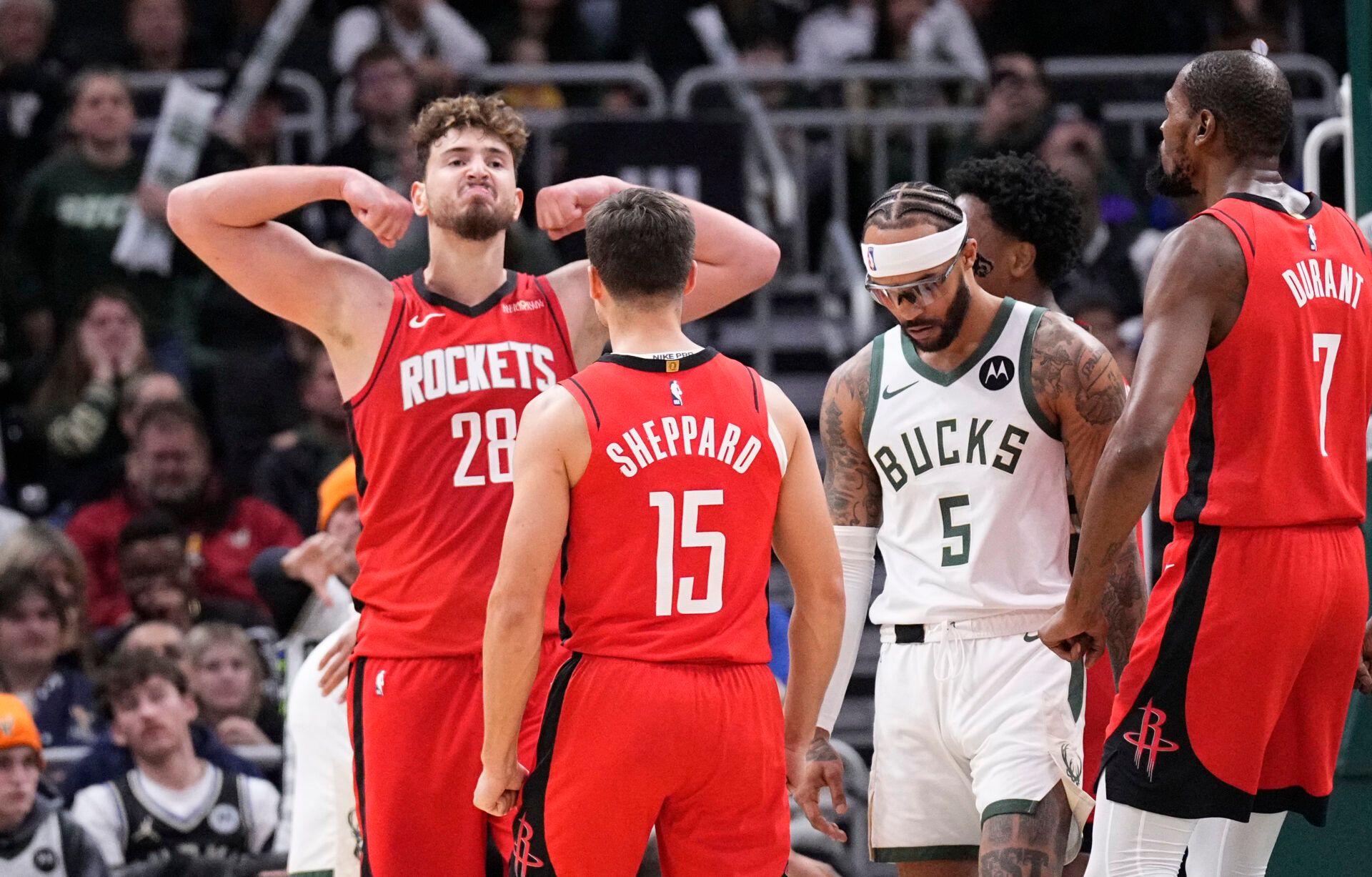 Houston Rockets center Alperen Sengun (28) flexes after making a basket in the final minute of the game at Fiserv Forum.