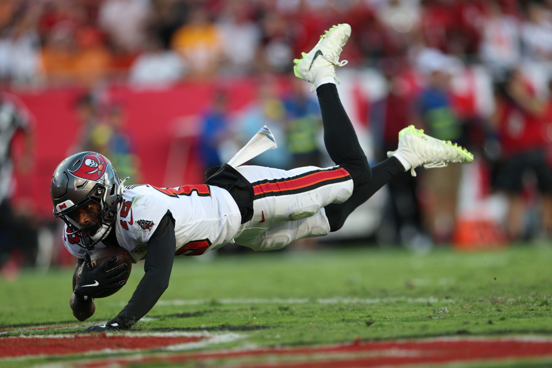 Tampa Bay Buccaneers wide receiver Tez Johnson (15) dives for a touchdown during the third quarter against the San Francisco 49ers at Raymond James Stadium.