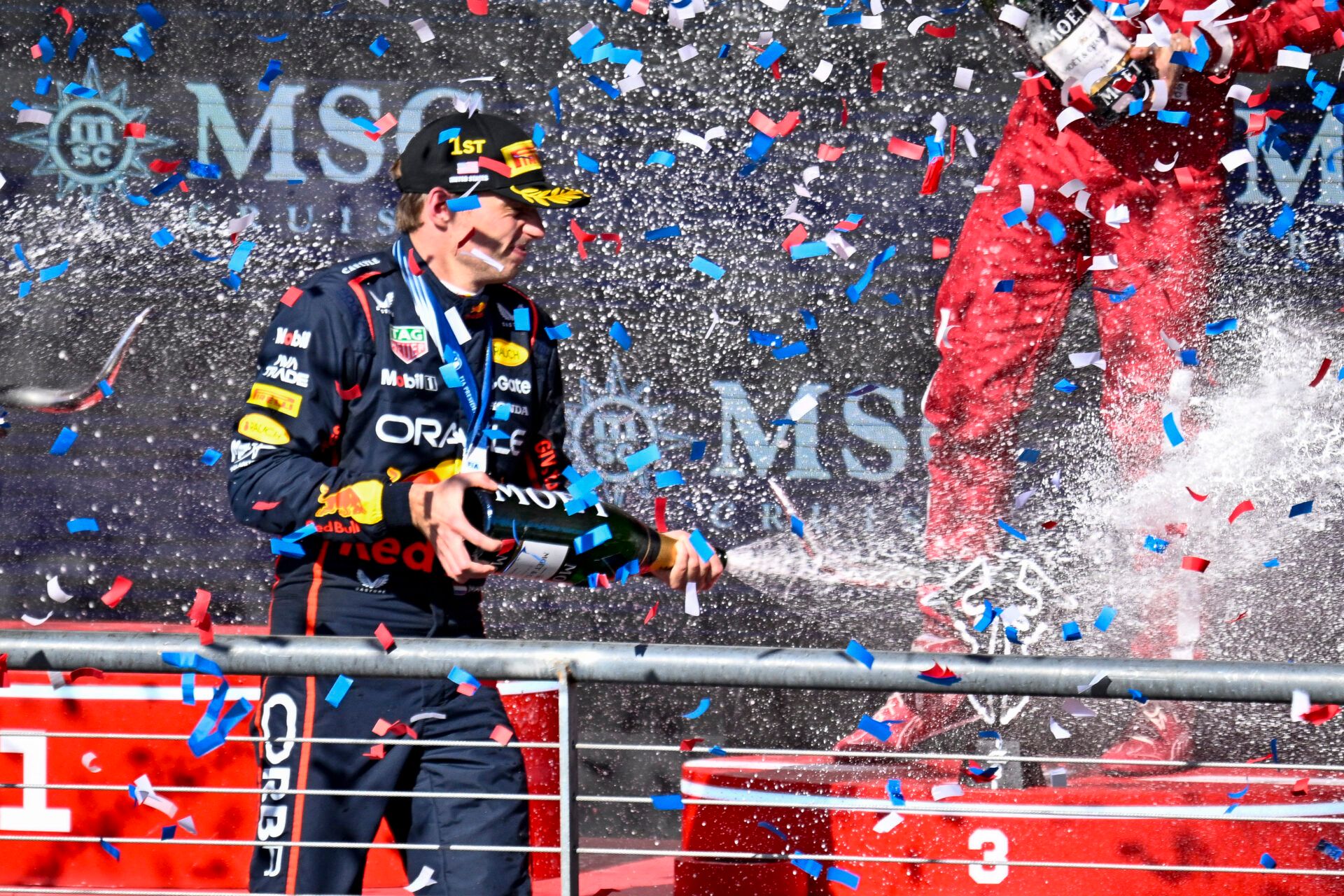 Oracle Red Bull Racing driver Max Verstappen of Team Netherlands sprays champagne after the 2025 US Grand Prix at Circuit of The Americas in Austin, Texas.
