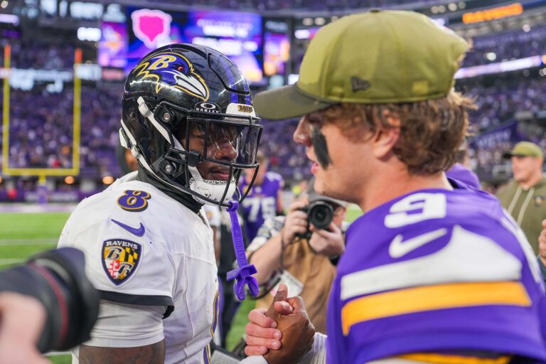 Baltimore Ravens quarterback Lamar Jackson (8) and Minnesota Vikings quarterback J.J. McCarthy (9) after the game at U.S. Bank Stadium.