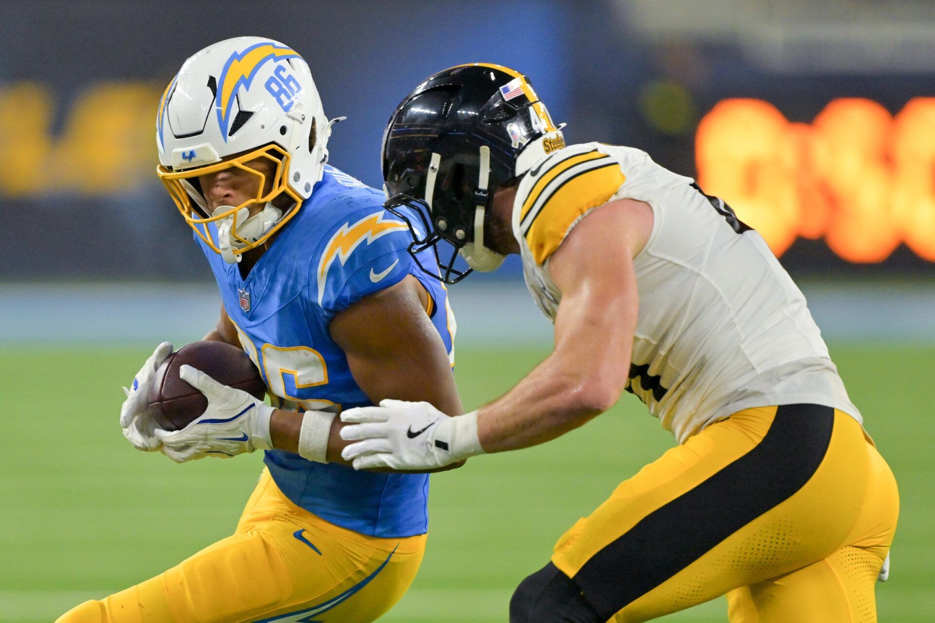 Pittsburgh Steelers linebacker Payton Wilson (41) forces Los Angeles Chargers tight end Oronde Gadsden II (86) out of bounds during the second quarter of the game at SoFi Stadium.