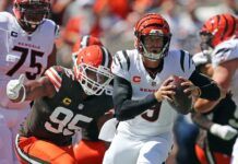 Cleveland Browns defensive end Myles Garrett (95) chases down Cincinnati Bengals quarterback Joe Burrow (9) during the first half of an NFL football game at Huntington Bank Field, Sept. 7, 2025, in Cleveland, Ohio.