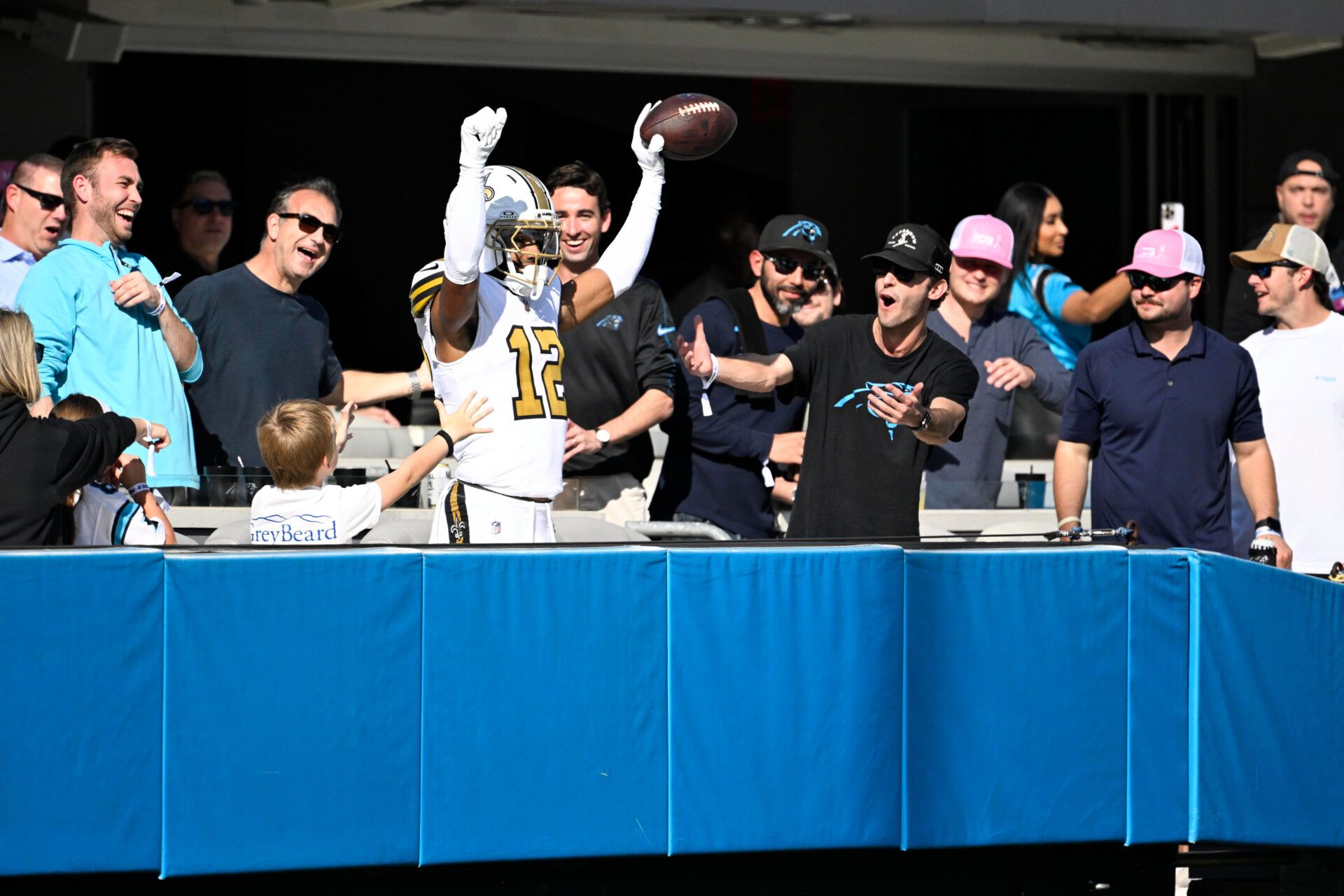 New Orleans Saints wide receiver Chris Olave (12) celebrates after scoring a touchdown during the second quarter against the Carolina Panthers at Bank of America Stadium.