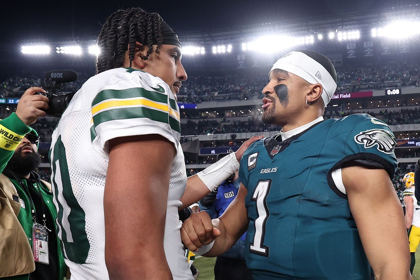 Green Bay Packers quarterback Jordan Love (10) and Philadelphia Eagles quarterback Jalen Hurts (1) shake hands after the game in an NFC wild card game at Lincoln Financial Field.