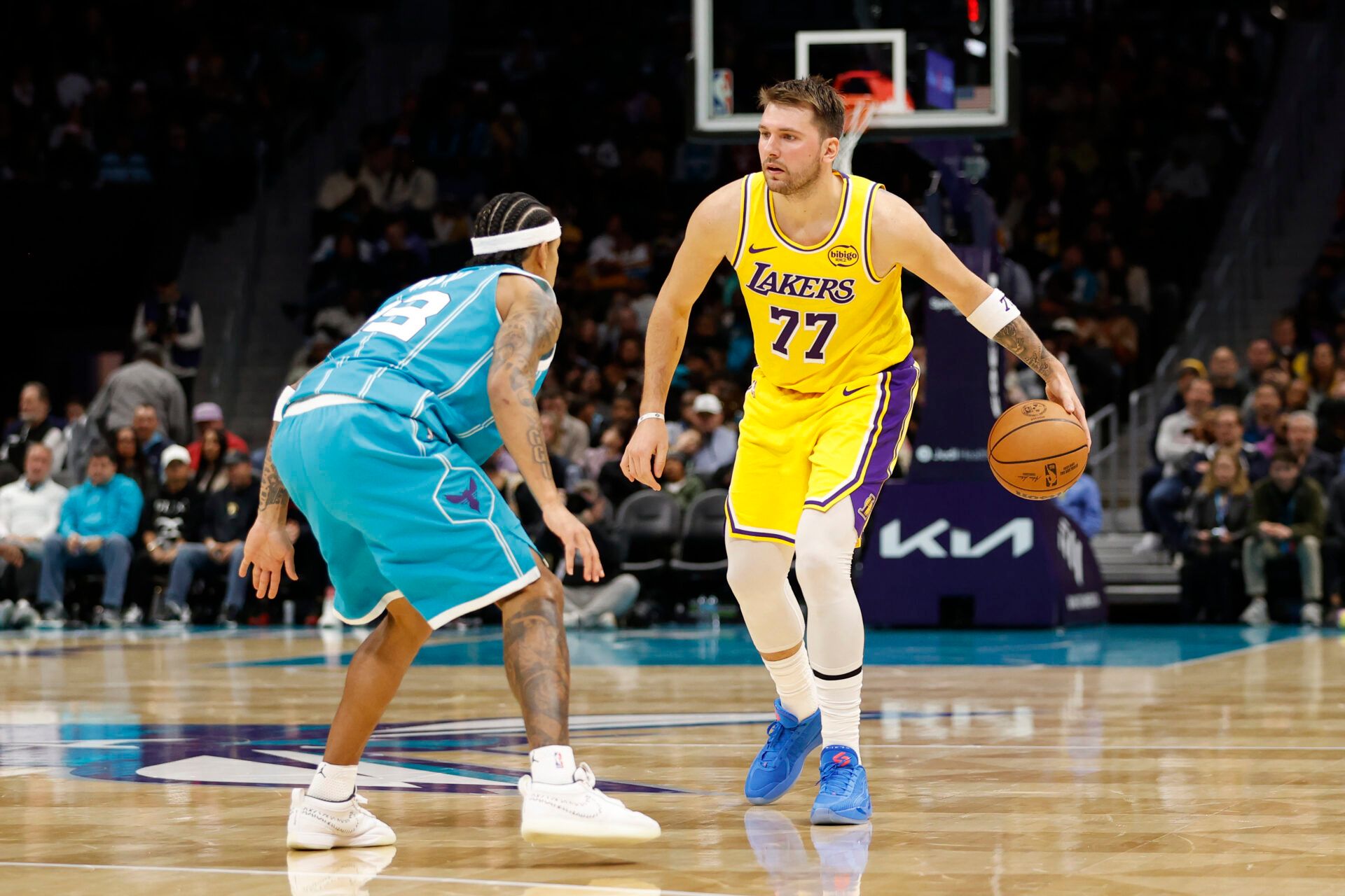 Los Angeles Lakers forward/guard Luka Doncic (77) is guarded by Charlotte Hornets guard Tre Mann (23) during the second quarter at Spectrum Center.