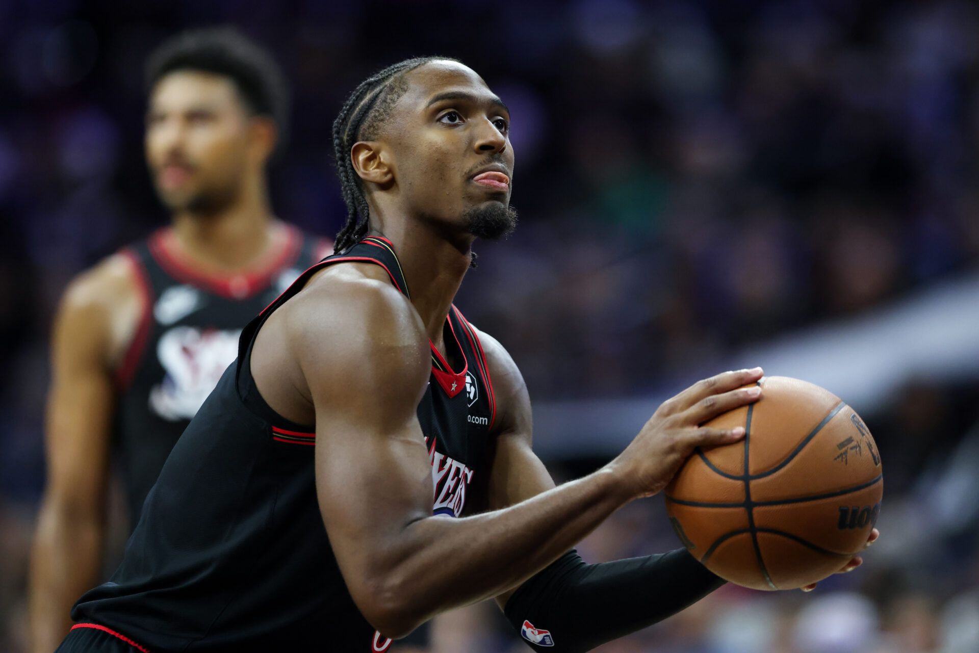 Philadelphia 76ers guard Tyrese Maxey (0) shoots a foul shot against the Detroit Pistons during the fourth quarter at Xfinity Mobile Arena.