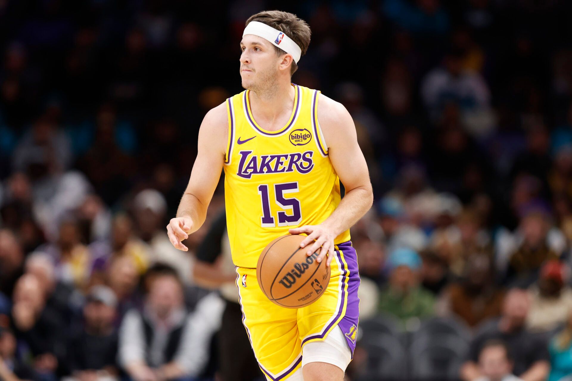 Los Angeles Lakers guard Austin Reaves (15) brings the ball up the court during the second quarter against the Charlotte Hornets at Spectrum Center.