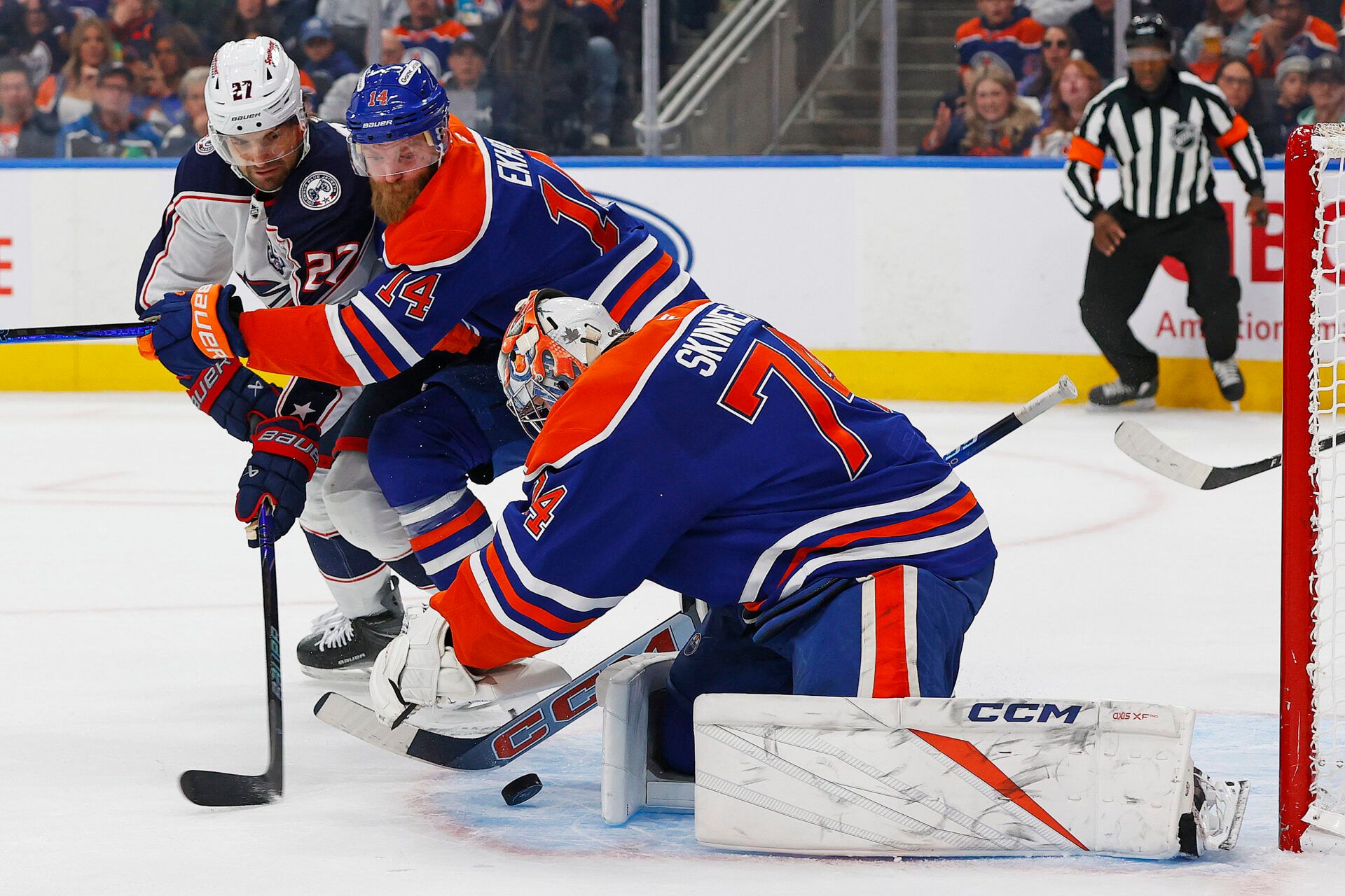 Columbus Blue Jackets forward Zach Aston-Reese (27) tries to get to a loose puck in front of Edmonton Oilers goaltender Stuart Skinner (74) during the second period at Rogers Place.