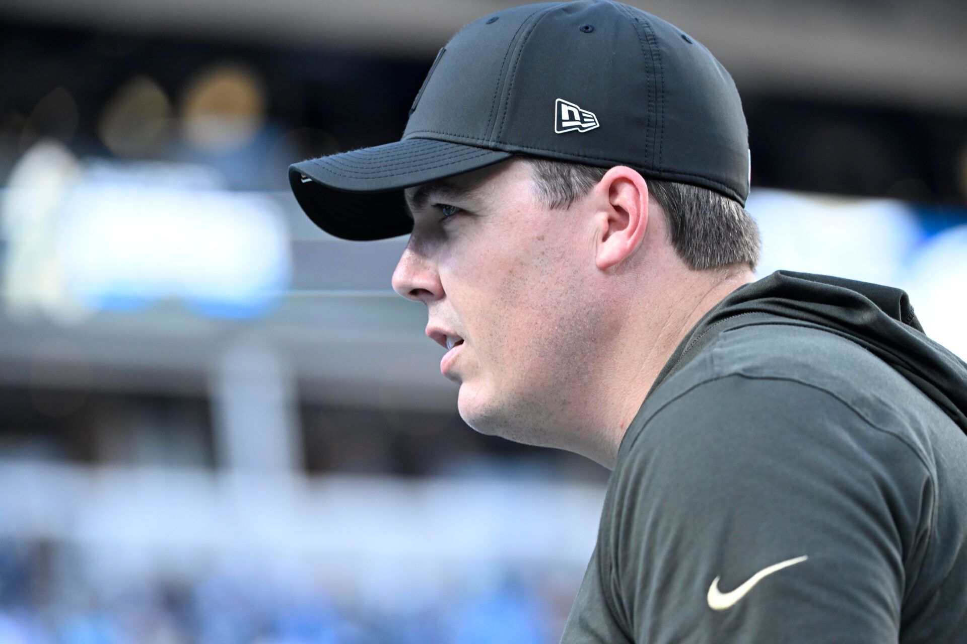 New Orleans Saints head coach Kellen Moore walks off the field after the game at Bank of America Stadium.