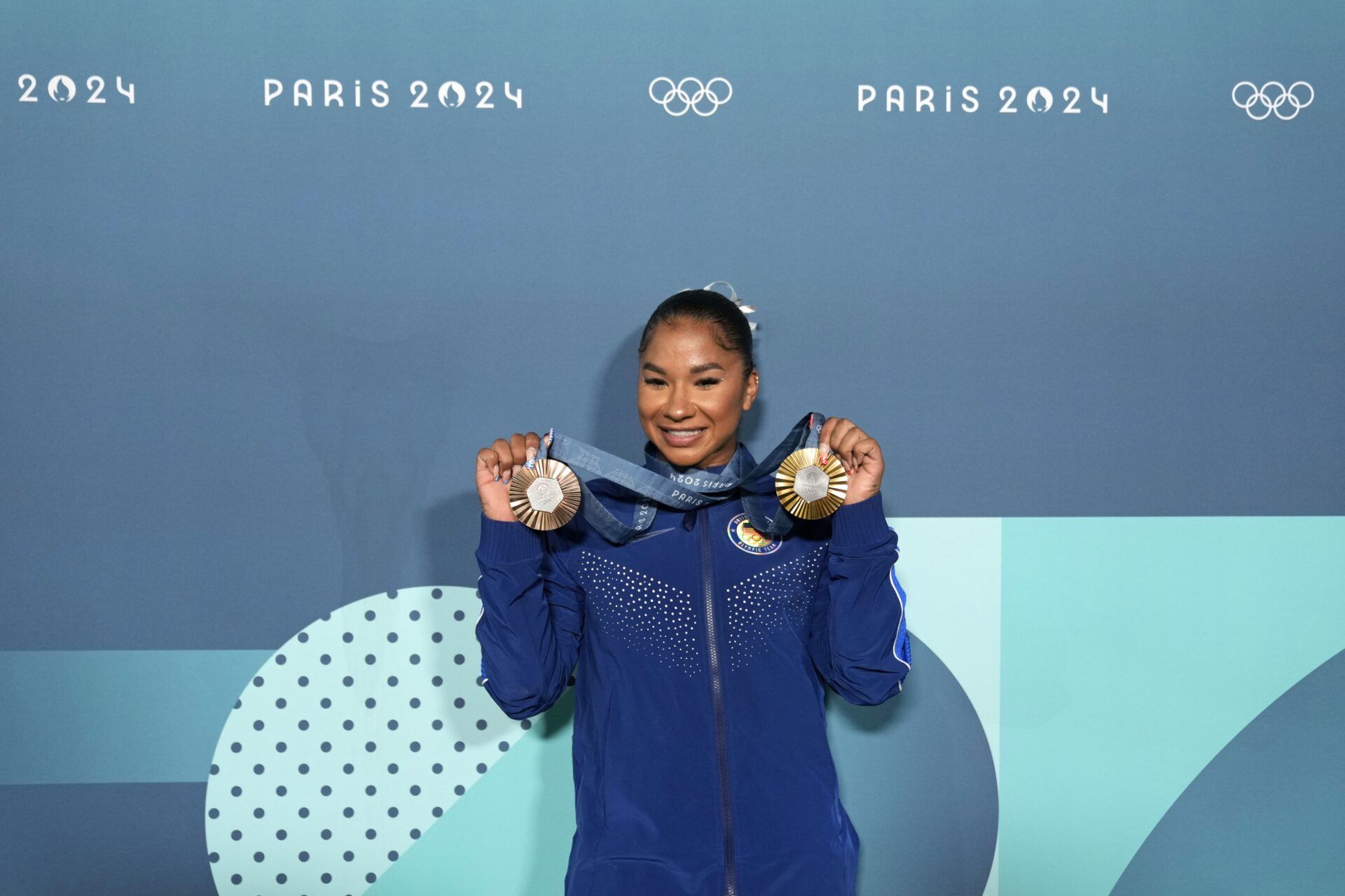 Jordan Chiles of the United States poses for a photo with her gold and bronze medasl after day three of the gymnastics event finals during the Paris 2024 Olympic Summer Games.