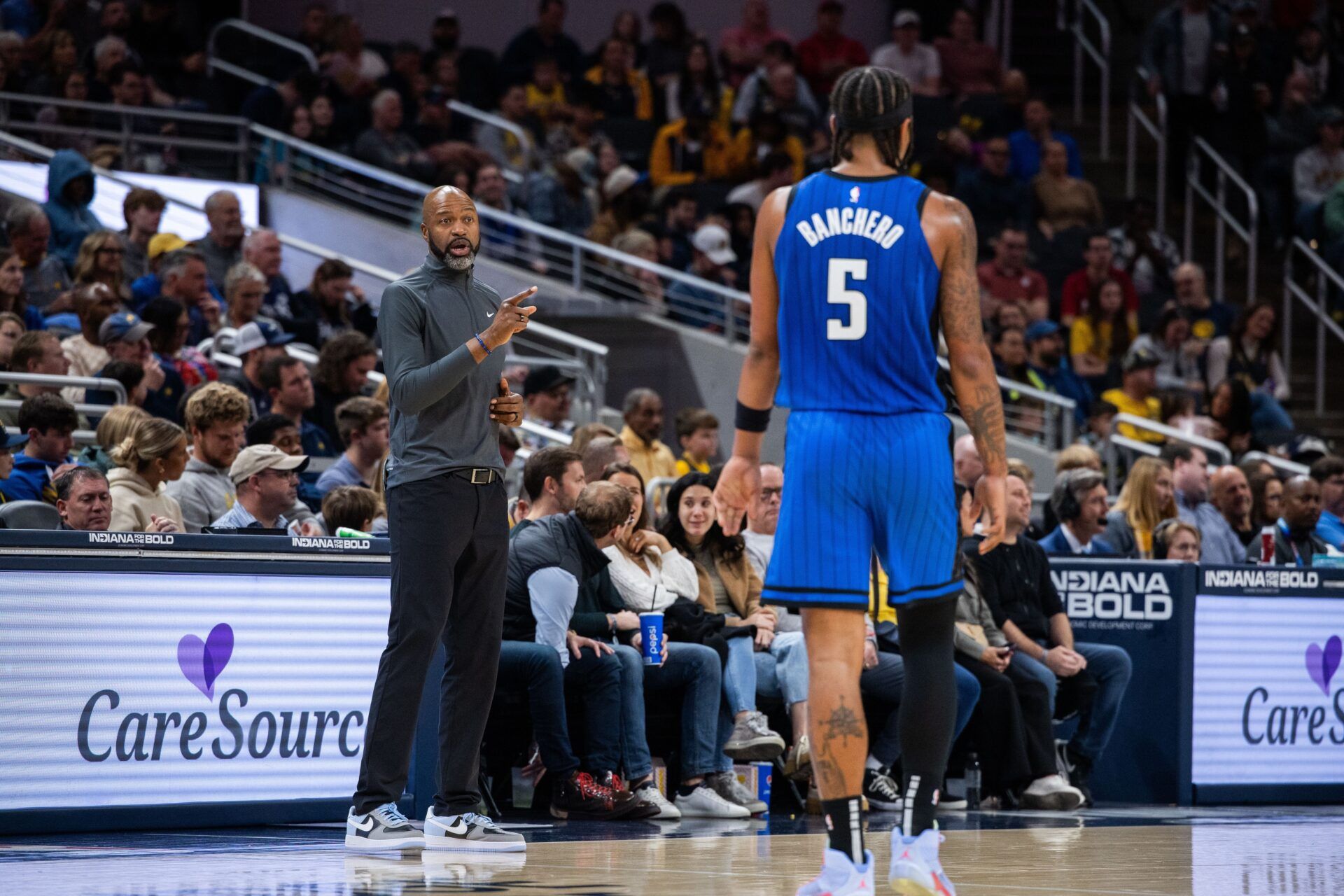Orlando Magic head coach Jamahl Mosley talks to forward Paolo Banchero (5) in the first half against the Indiana Pacers at Gainbridge Fieldhouse.