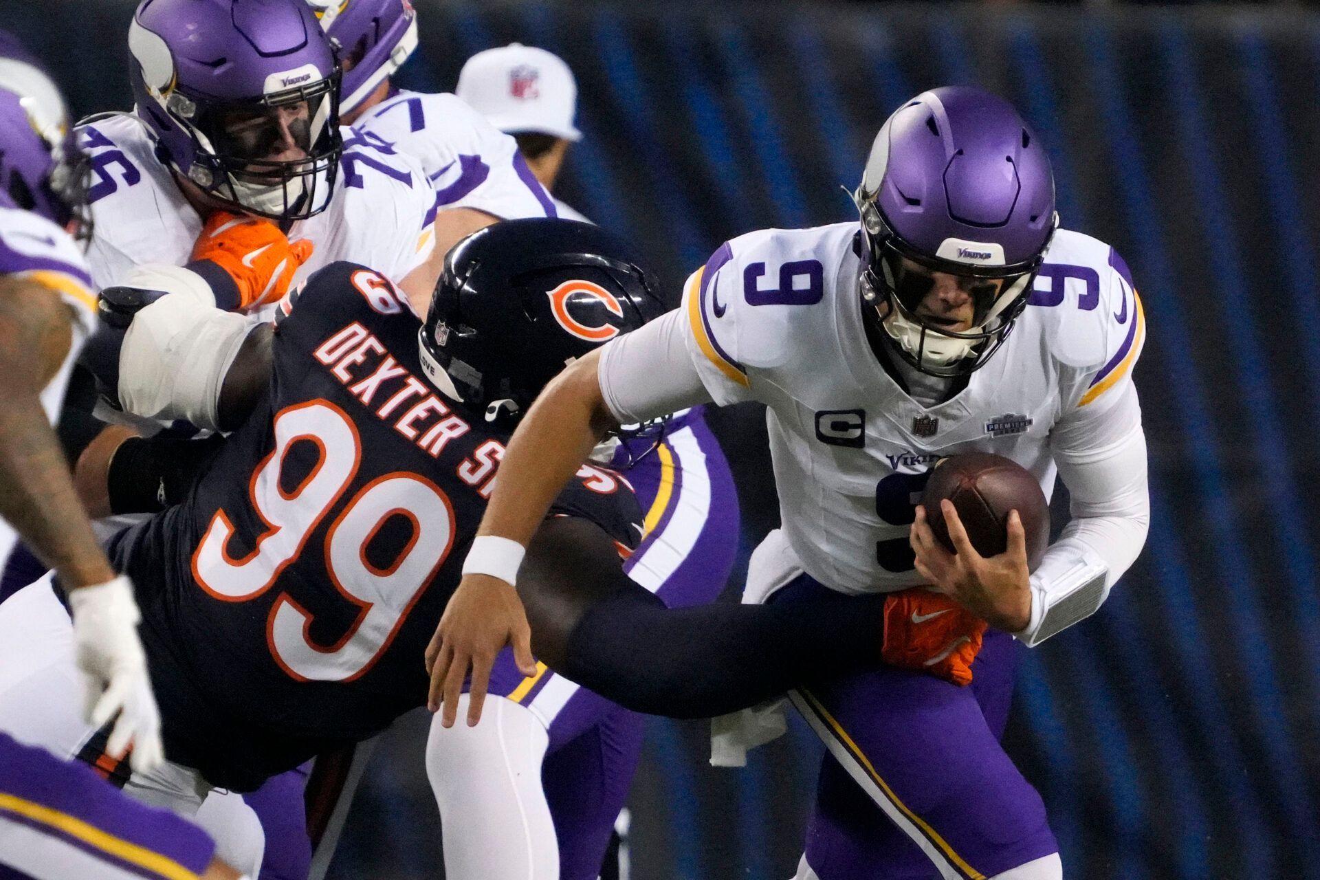 Chicago Bears defensive tackle Gervon Dexter Sr. (99) tackles Minnesota Vikings quarterback J.J. McCarthy (9) during the first half at Soldier Field.