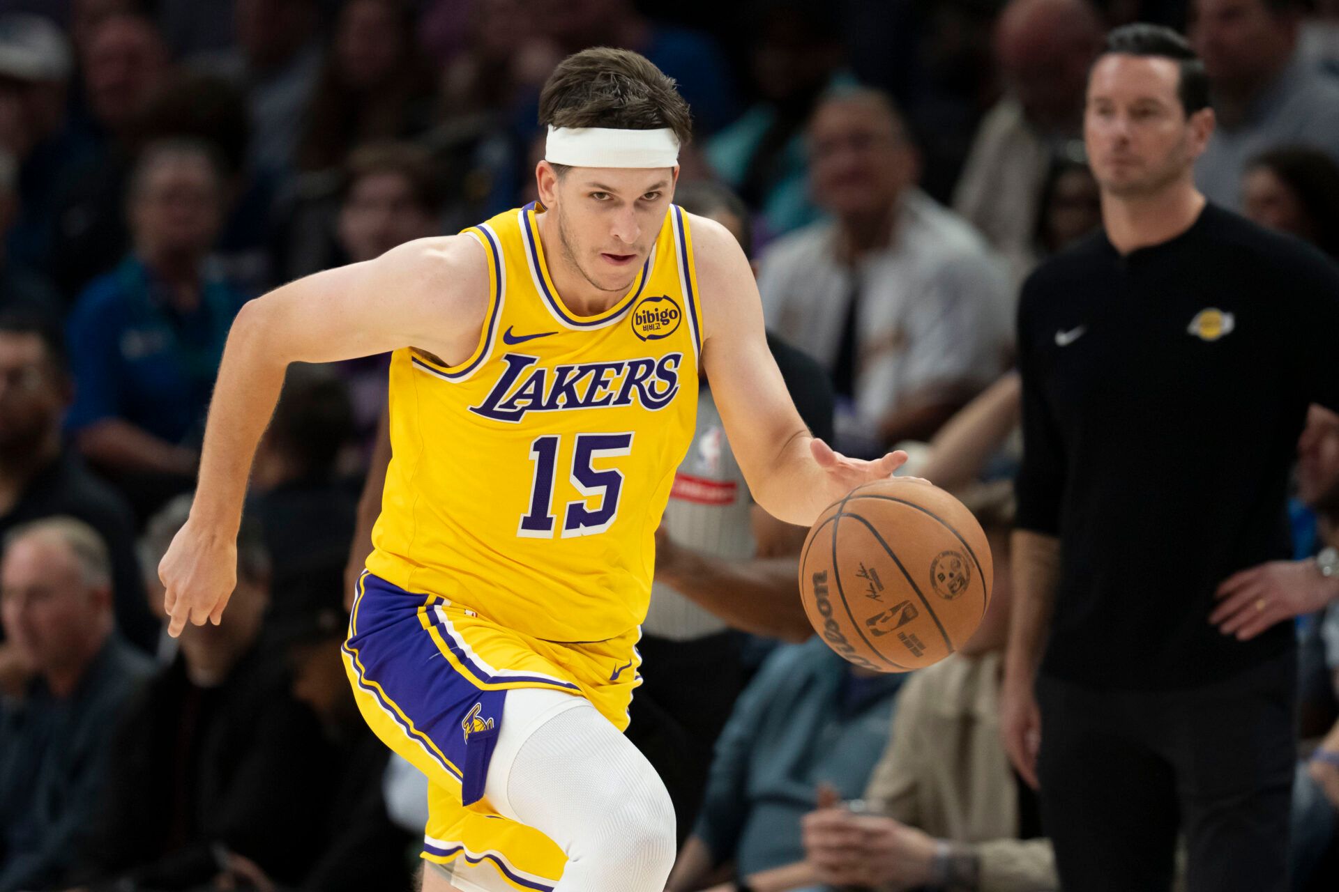 Los Angeles Lakers guard Austin Reaves (15) dribbles the ball against the Minnesota Timberwolves in the second half at Target Center.