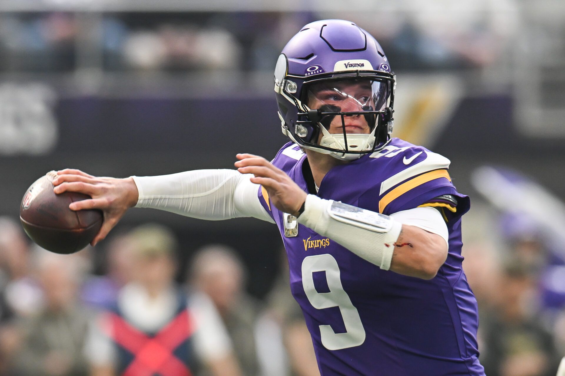 Minnesota Vikings quarterback J.J. McCarthy (9) throws a pass against the Baltimore Ravens during the first quarter at U.S. Bank Stadium.