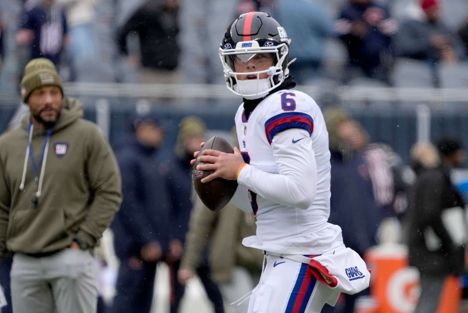 New York Giants quarterback Jaxson Dart (6) warms up before a game against the Chicago Bears at Soldier Field.