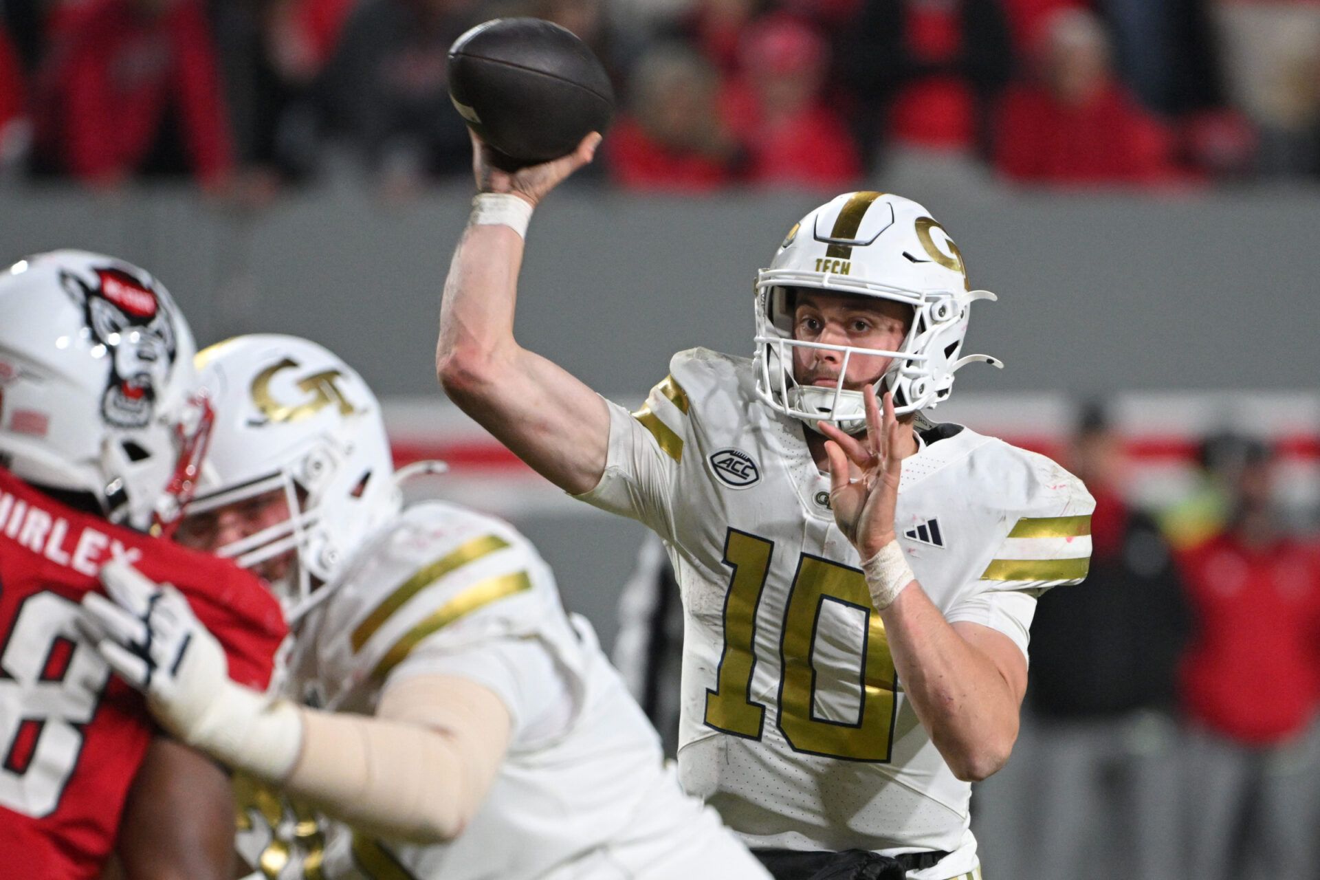 Georgia Tech Yellow Jackets quarterback Haynes King (10) throws a pass in the fourth quarter against the NC State Wolfpack at Carter-Finley Stadium.