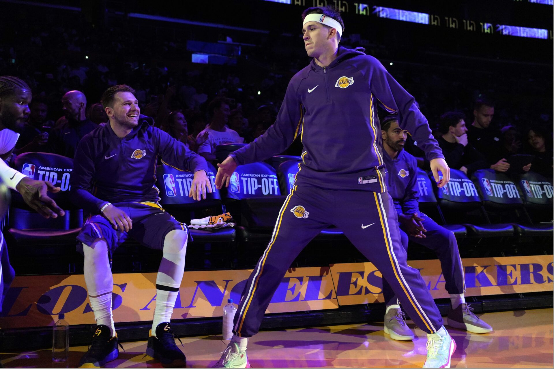 Los Angeles Lakers guard Luka Doncic (left) and guard Austin Reaves (15) interact before the game against the Minnesota Timberwolves  at Crypto.com Arena.