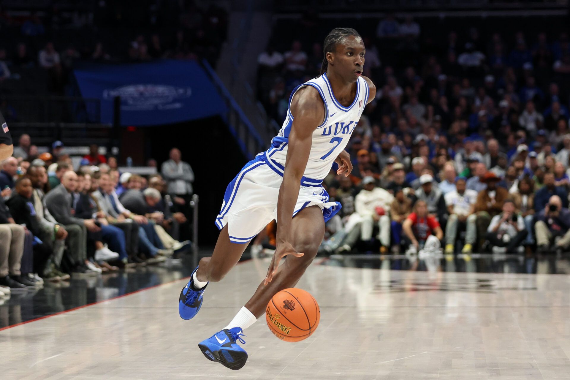 Duke Blue Devils guard Dame Sarr (7) drives the ball against the Texas Longhorns during the first half of the Dick Vitale’s Invitational game at Spectrum Center.