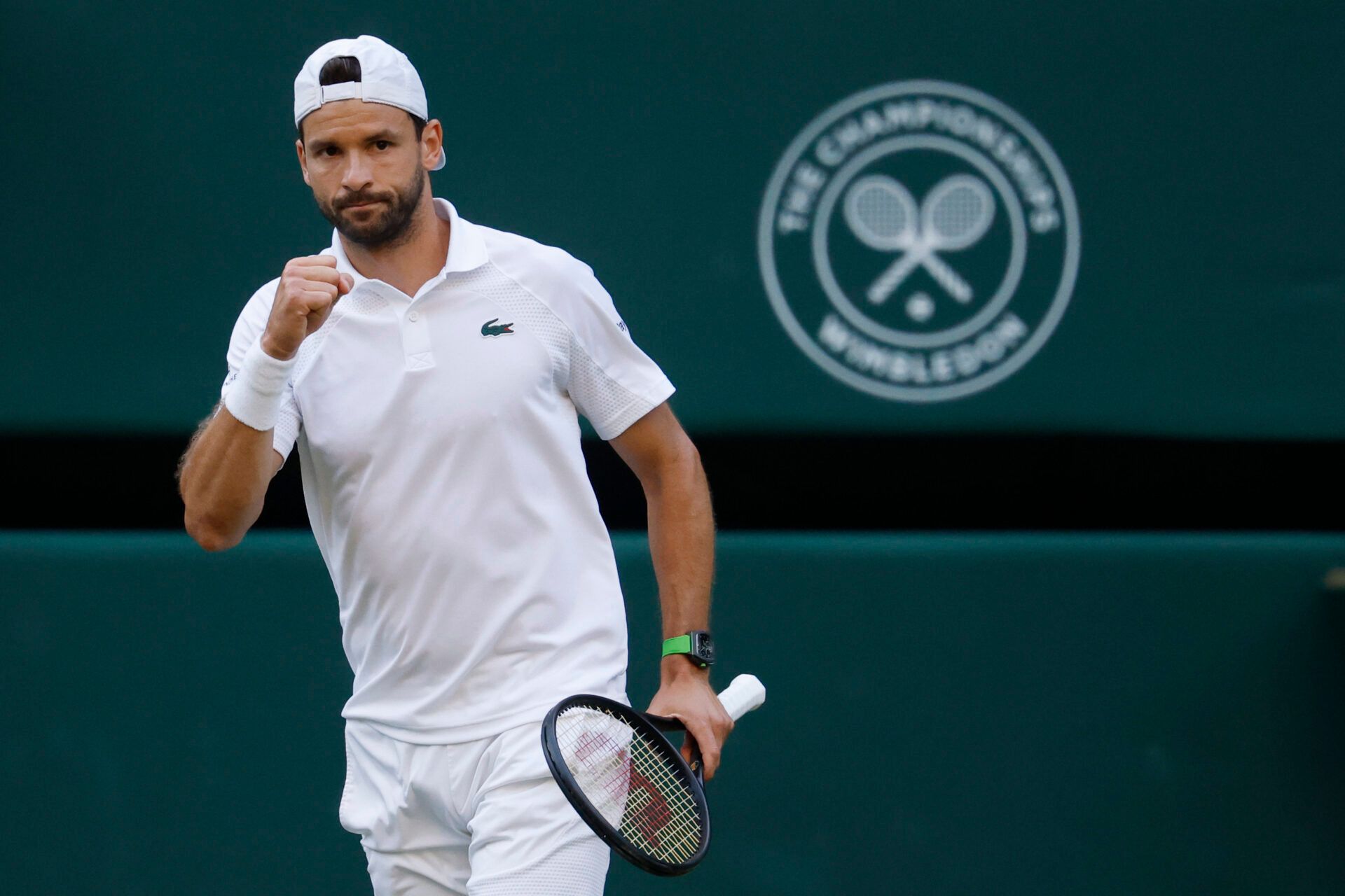 Grigor Dimitrov (BUL) reacts after winning the second set against Jannik Sinner (ITA)(not pictured) on day eight of The Championships Wimbledon 2025 at All England Lawn Tennis and Croquet Club.