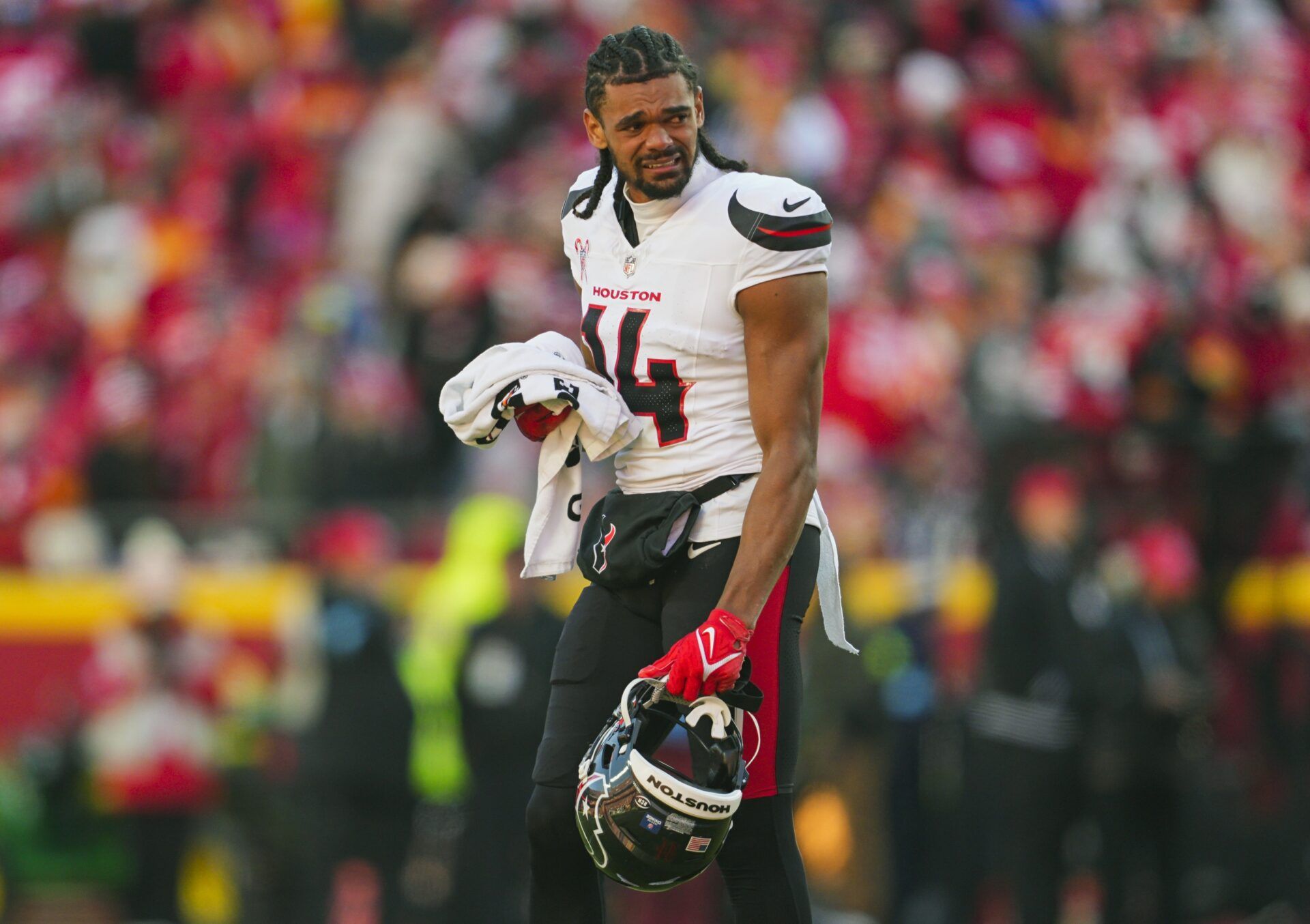 Houston Texans wide receiver Jared Wayne (14) reacts after an injury to wide receiver Tank Dell (not pictured) during the second half against the Kansas City Chiefs at GEHA Field at Arrowhead Stadium.