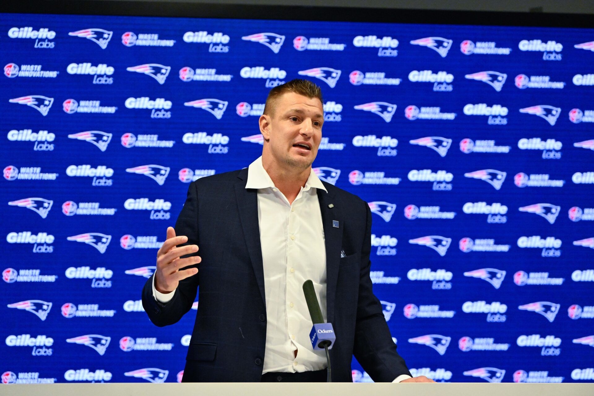New England Patriots former player and current Fox Sports football analyst Rob Gronkowski speaks during a press conference where he signed a ceremonial one day contract at Gillette Stadium.