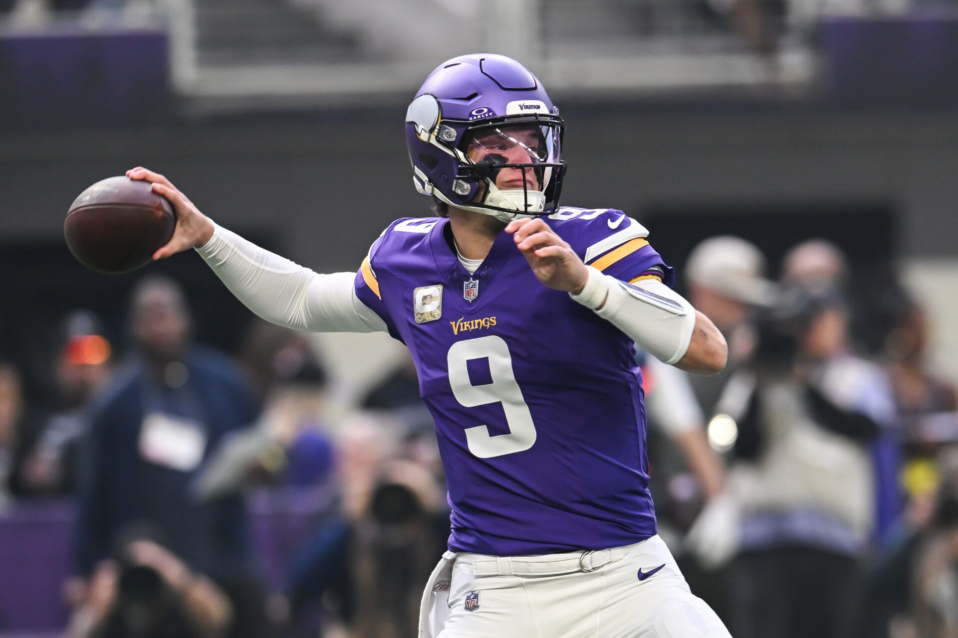 Minnesota Vikings quarterback J.J. McCarthy (9) throws a pass against the Baltimore Ravens during the first quarter at U.S. Bank Stadium.