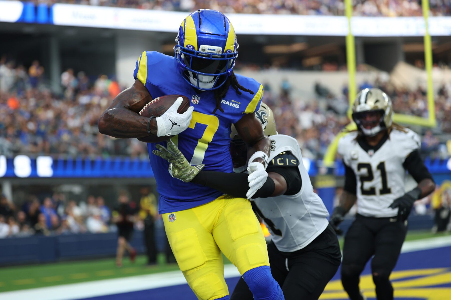 Los Angeles Rams wide receiver Davante Adams (17) makes a touchdown catch in front of New Orleans Saints cornerback Kool-Aid McKinstry (4) during the second half at SoFi Stadium.