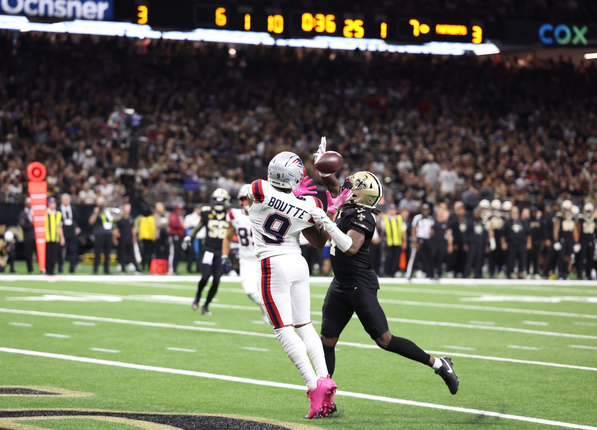 New England Patriots wide receiver Kayshon Boutte (9) catches a touchdown pass past New Orleans Saints cornerback Kool-Aid McKinstry (4) during the first quarter at Caesars Superdome.