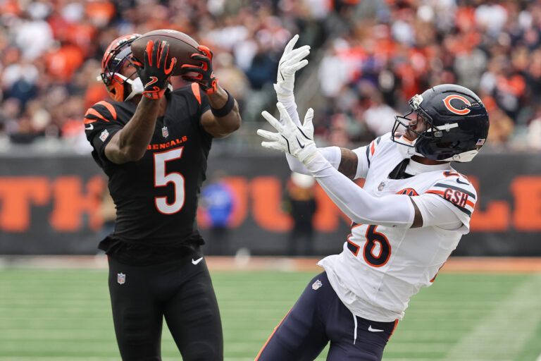 Cincinnati Bengals wide receiver Tee Higgins (5) catches a 44-yard touchdown pass thrown by quarterback Joe Flacco (not pictured) against Chicago Bears cornerback Nahshon Wright (26) during the second quarter at Paycor Stadium.