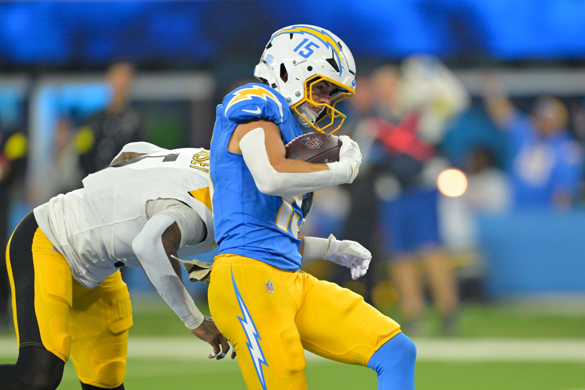 Los Angeles Chargers wide receiver Ladd McConkey (15) scores a touchdown defended by Pittsburgh Steelers cornerback Jalen Ramsey (5) during the second quarter of the game at SoFi Stadium.