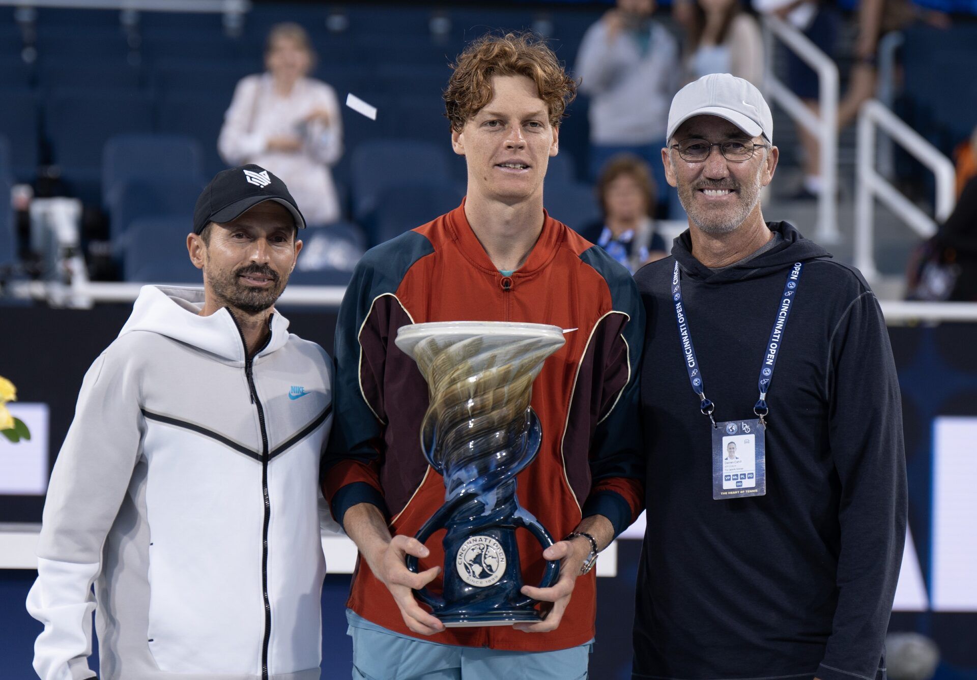 Aug 19 2024; Cincinnati, OH, USA; Jannik Sinner of Italy and his coaches, Simone Vagnozzi and Darren Cahill at the trophy presentation on day seven of the Cincinnati Open.