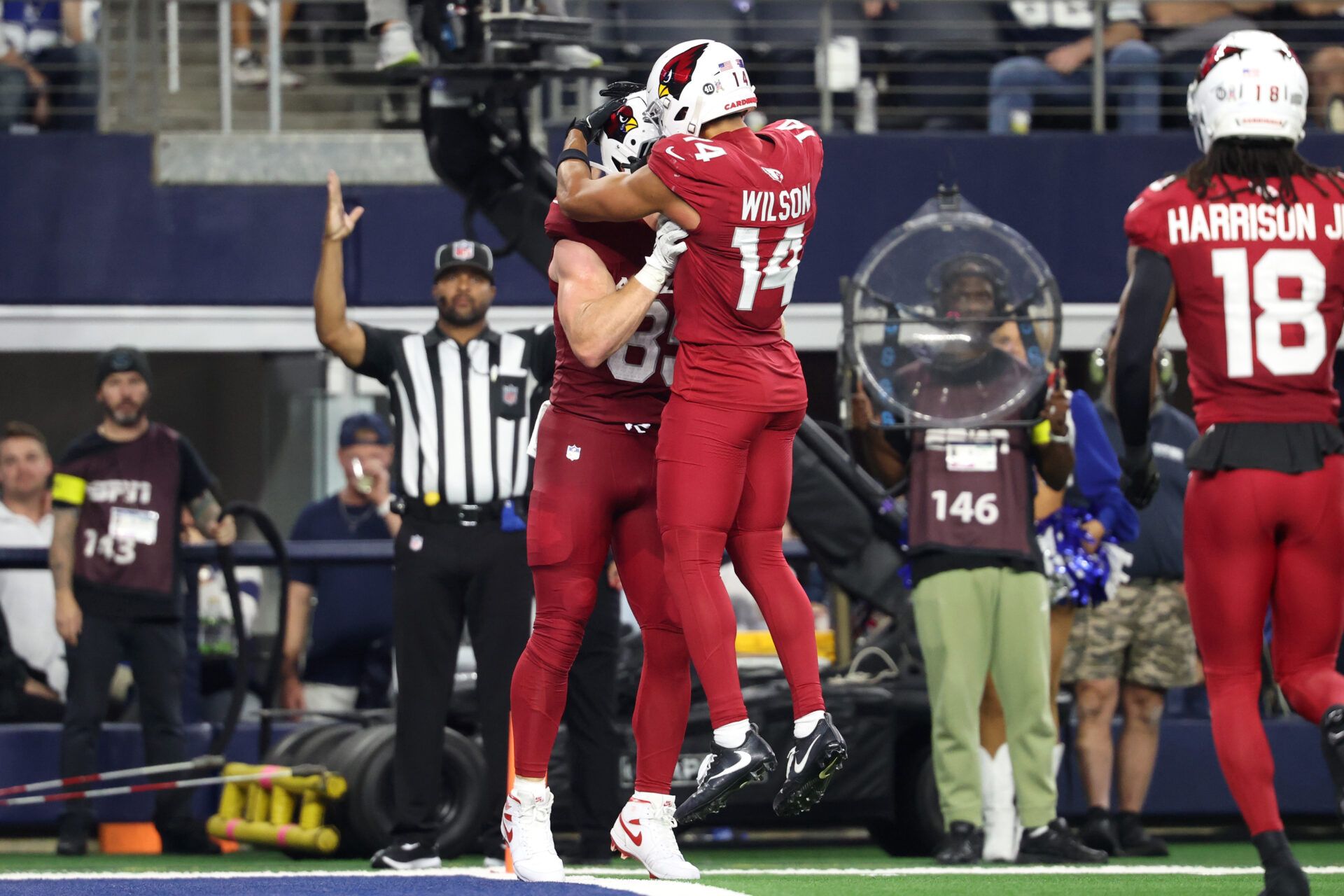 Arizona Cardinals tight end Trey McBride (85) celebrates with wide receiver Michael Wilson (14) after scoring a touchdown against the Dallas Cowboys in the second half at AT&T Stadium.