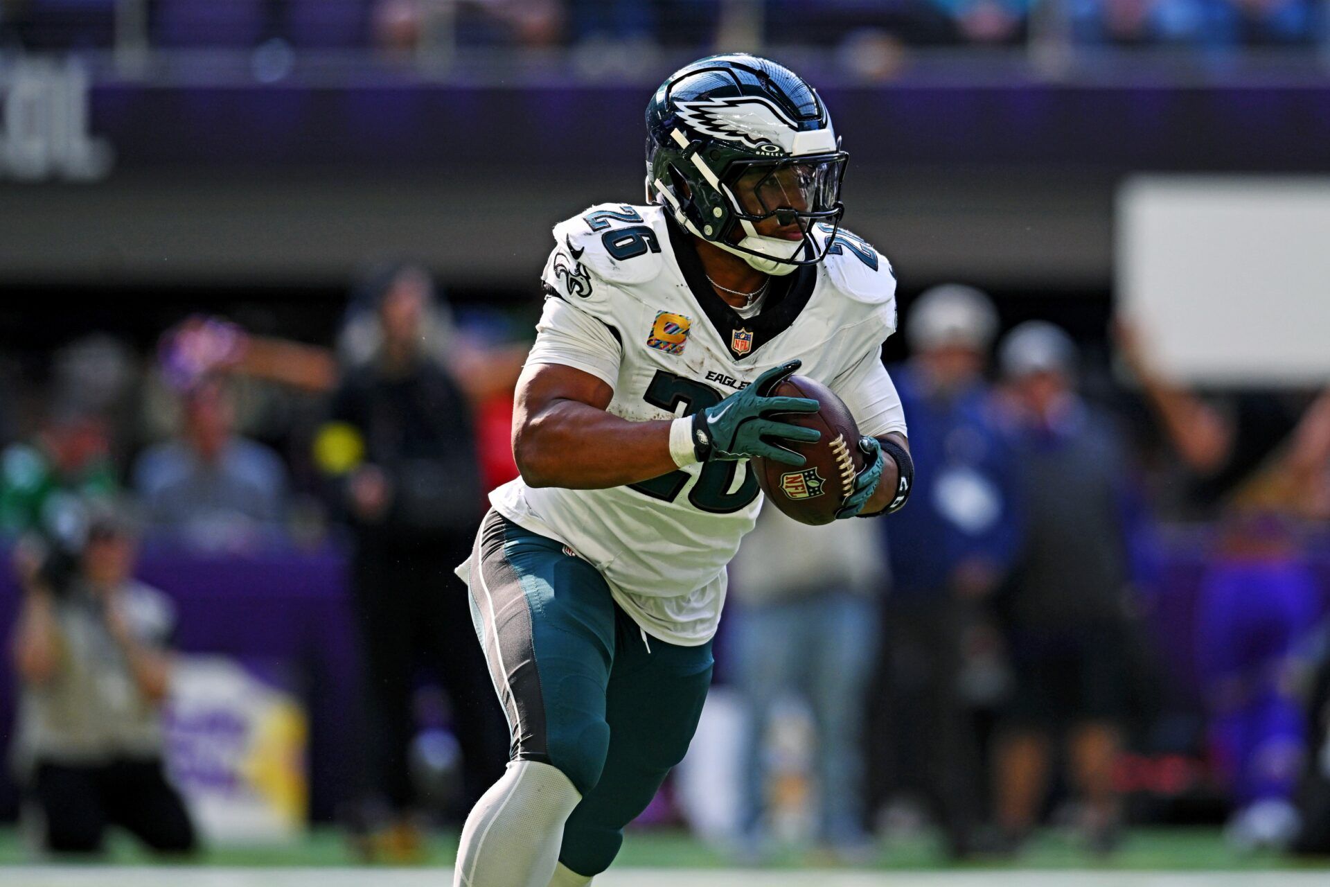 Philadelphia Eagles running back Saquon Barkley (26) controls the ball during the second half against the Minnesota Vikings at U.S. Bank Stadium.
