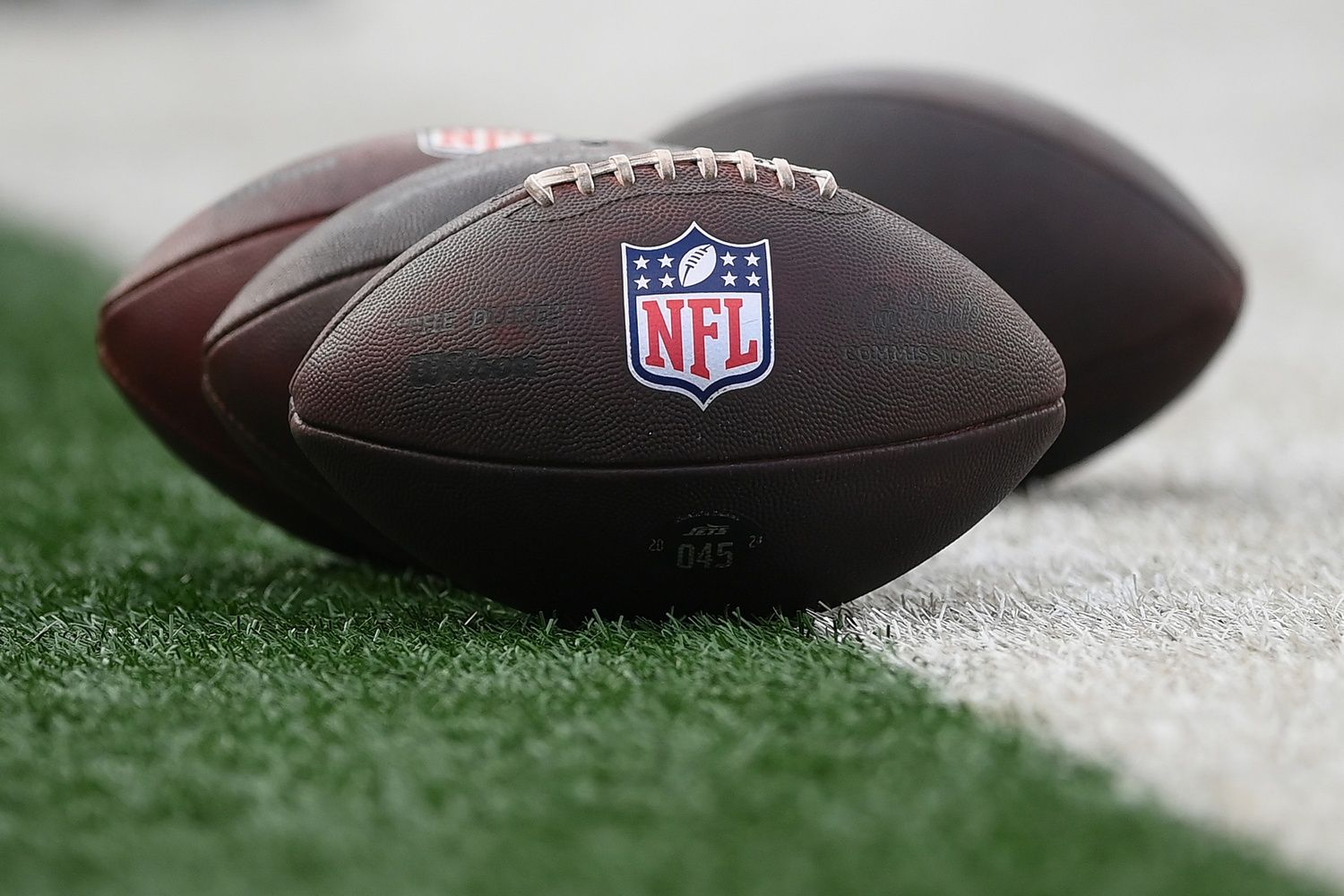 General view of the National Football League logo on footballs prior to the game between the New York Jets and the New York Giants at MetLife Stadium.
