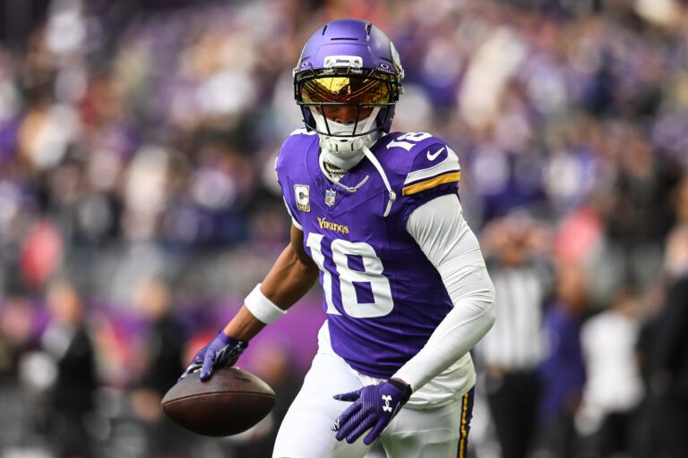 Minnesota Vikings wide receiver Justin Jefferson (18) warms up before the game against the Baltimore Ravens at U.S. Bank Stadium.