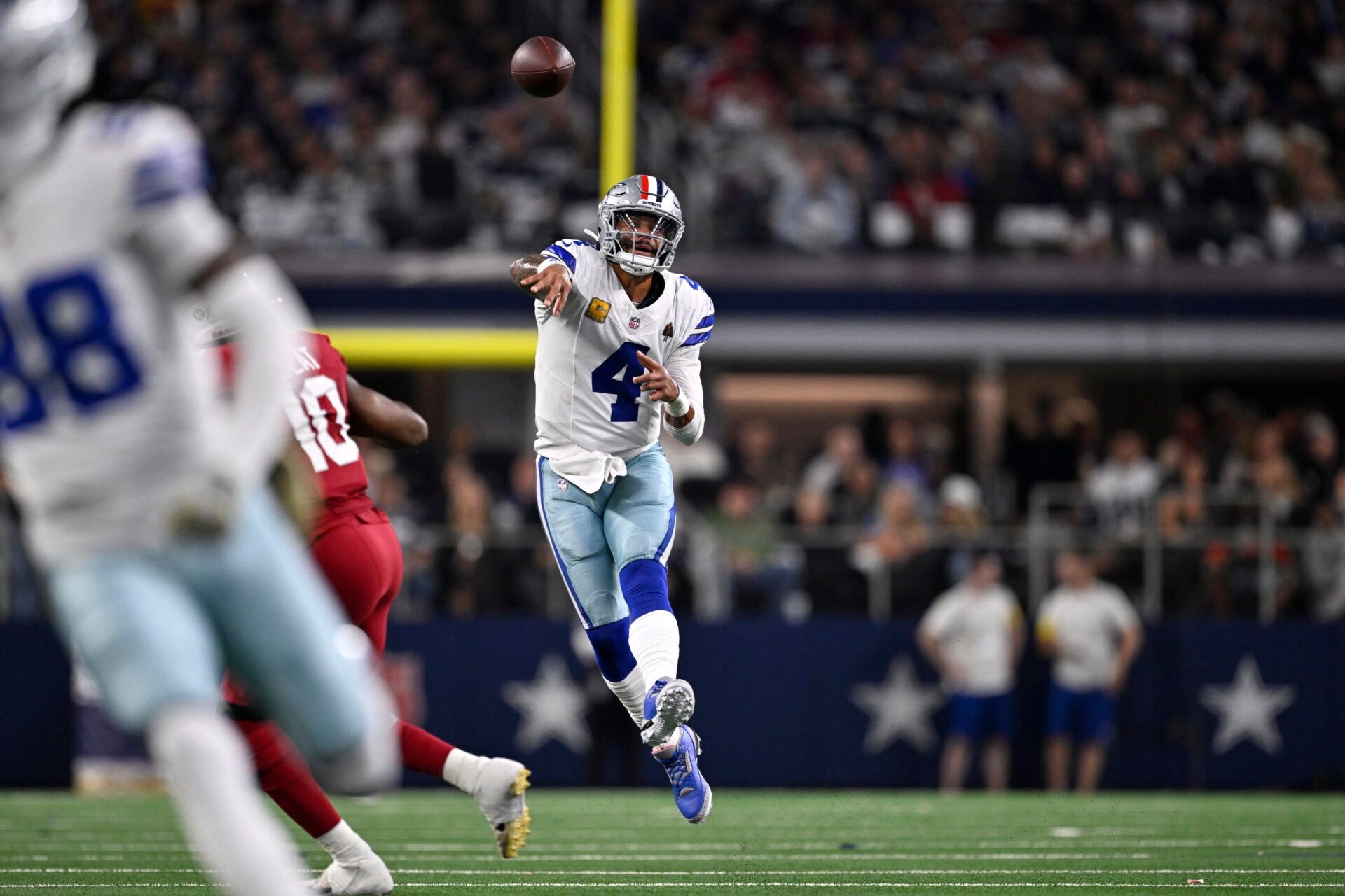 Dallas Cowboys quarterback Dak Prescott (4) throws a pass against the Arizona Cardinals in the first half at AT&T Stadium.