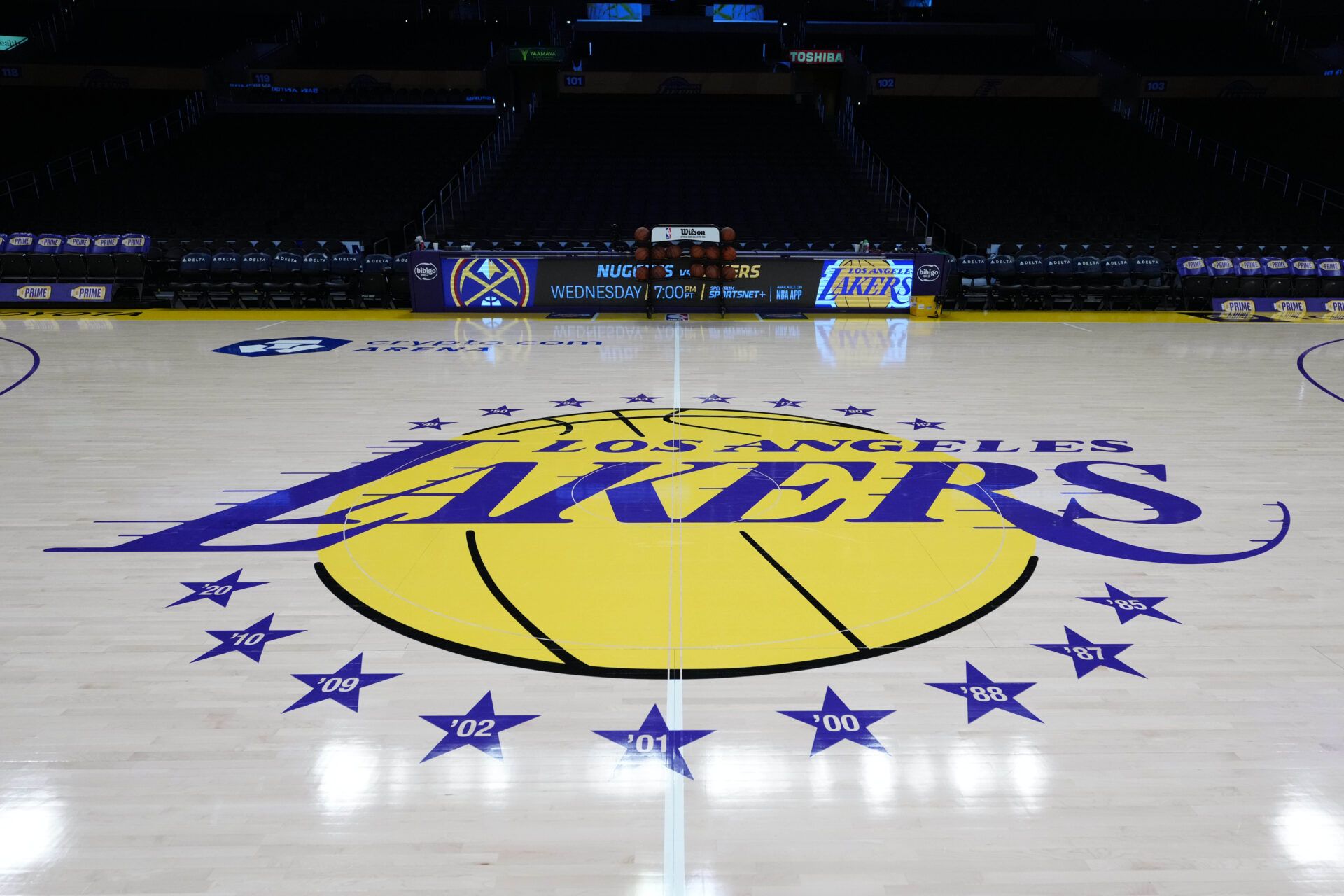 The Los Angeles Lakers logo at midcourt at Crypto.com Arena.