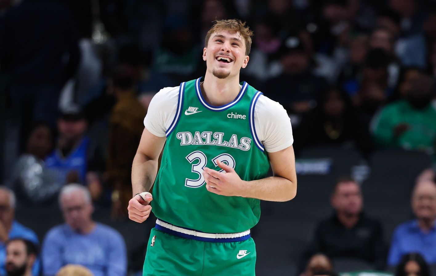Dallas Mavericks forward Cooper Flagg (32) laughs during the third quarter against the Milwaukee Bucks at American Airlines Center.