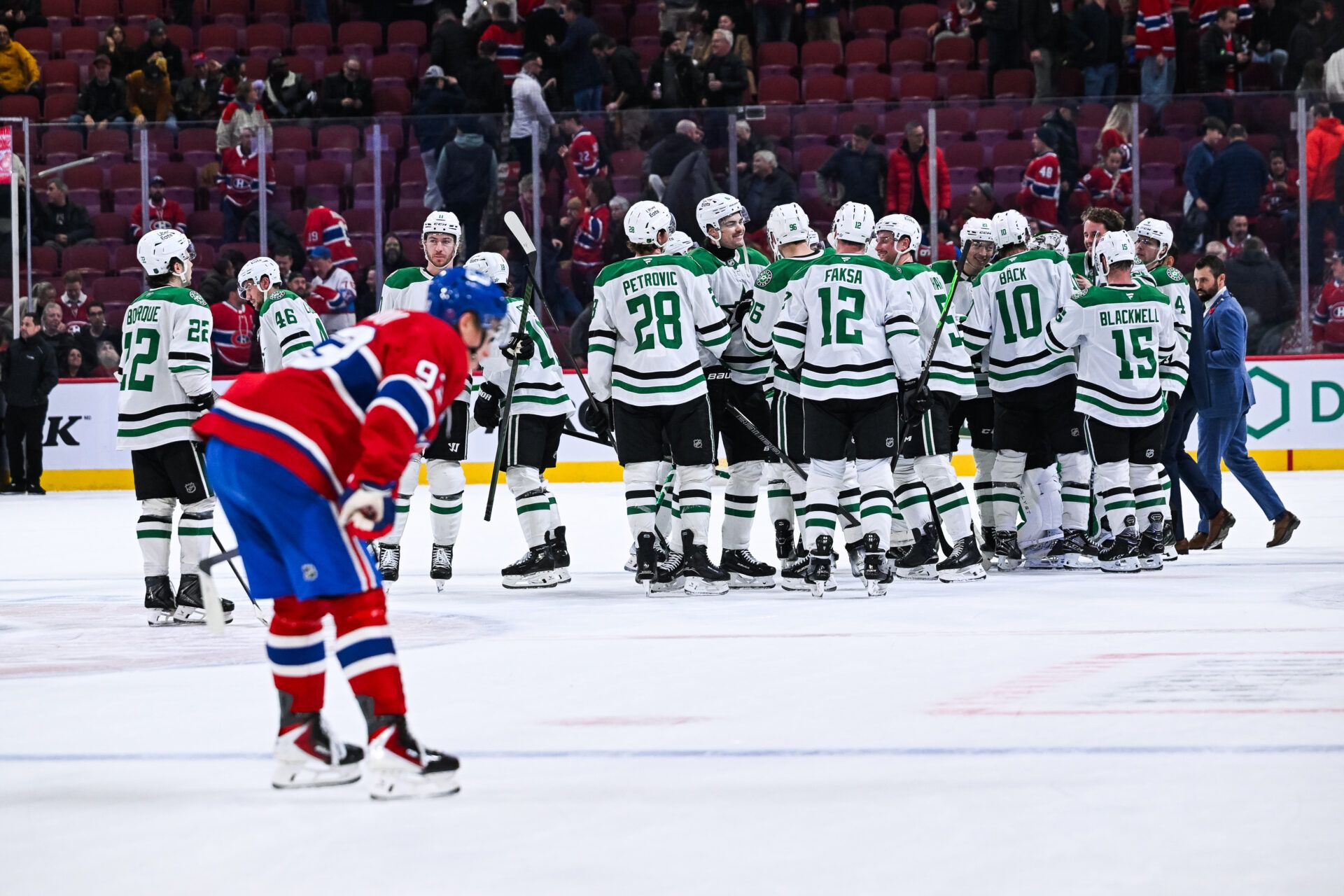 Dallas Stars players gather together to celebrate their win against the Montreal Canadiens after the third period at Bell Centre.