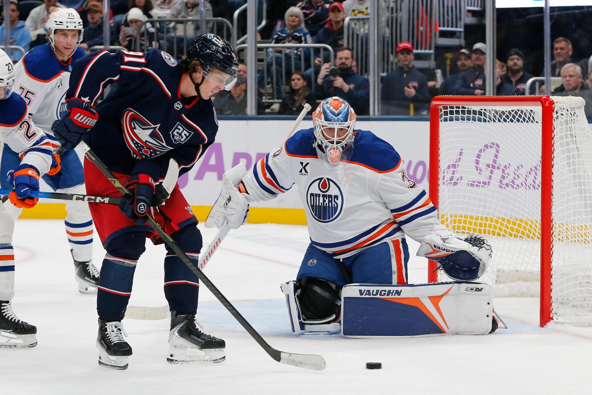 Columbus Blue Jackets left wing Miles Wood (11) reaches for a rebound against Edmonton Oilers goalie Calvin Pickard (30) during the second period at Nationwide Arena.