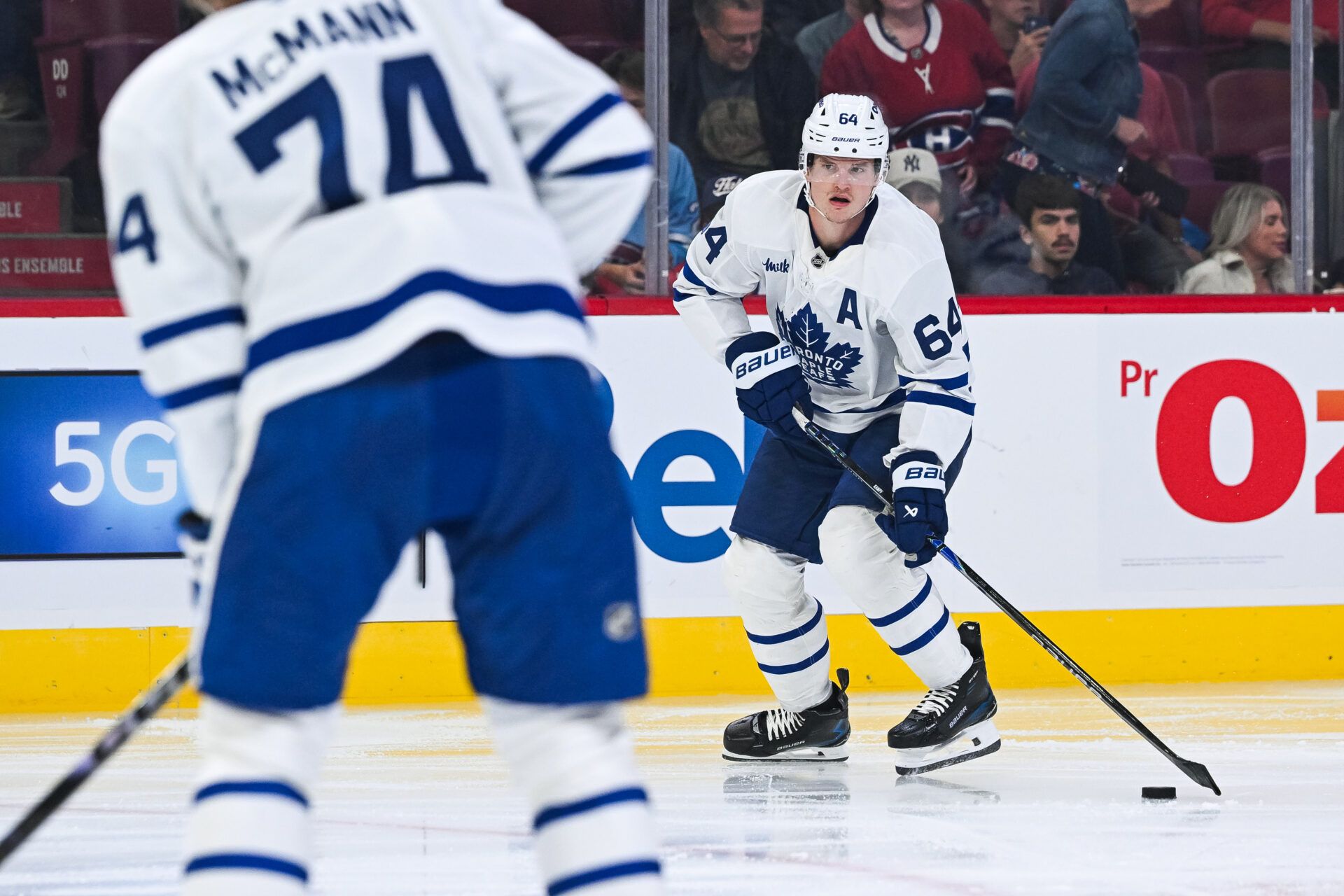 Toronto Maple Leafs forward David Kampf (64) plays the puck against the Montreal Canadiens during the second period at Bell Centre.
