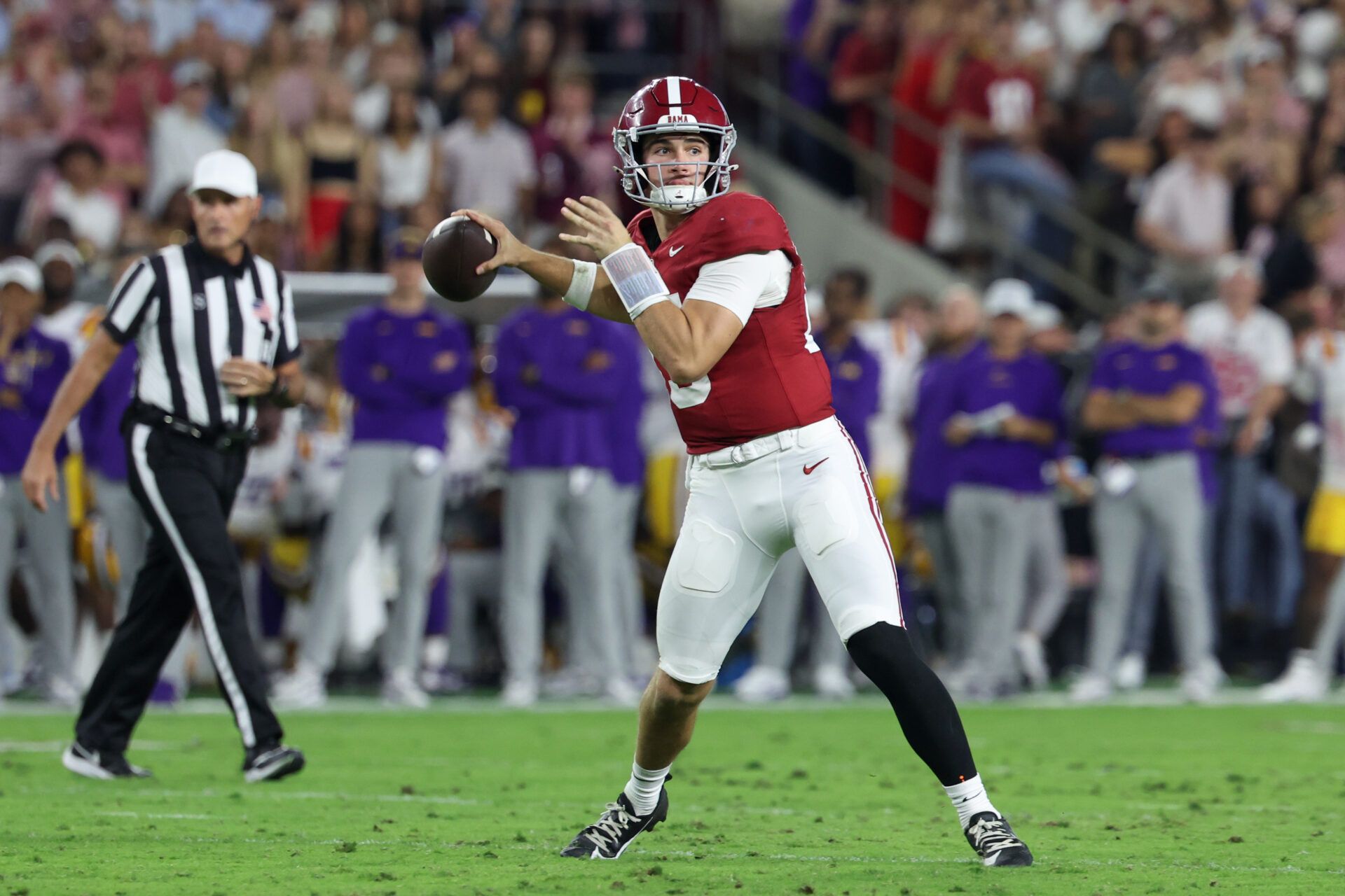 Alabama Crimson Tide quarterback Ty Simpson (15) passes the ball against the Louisiana State Tigers during the first quarter of the game at Saban Field at Bryant-Denny Stadium.