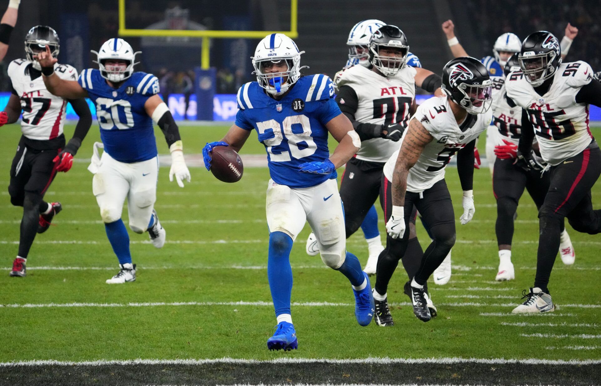 Indianapolis Colts running back Jonathan Taylor (28) scores the winning touchdown in overtime against the Atlanta Falcons during the NFL Berlin Game at Olympic Stadium.