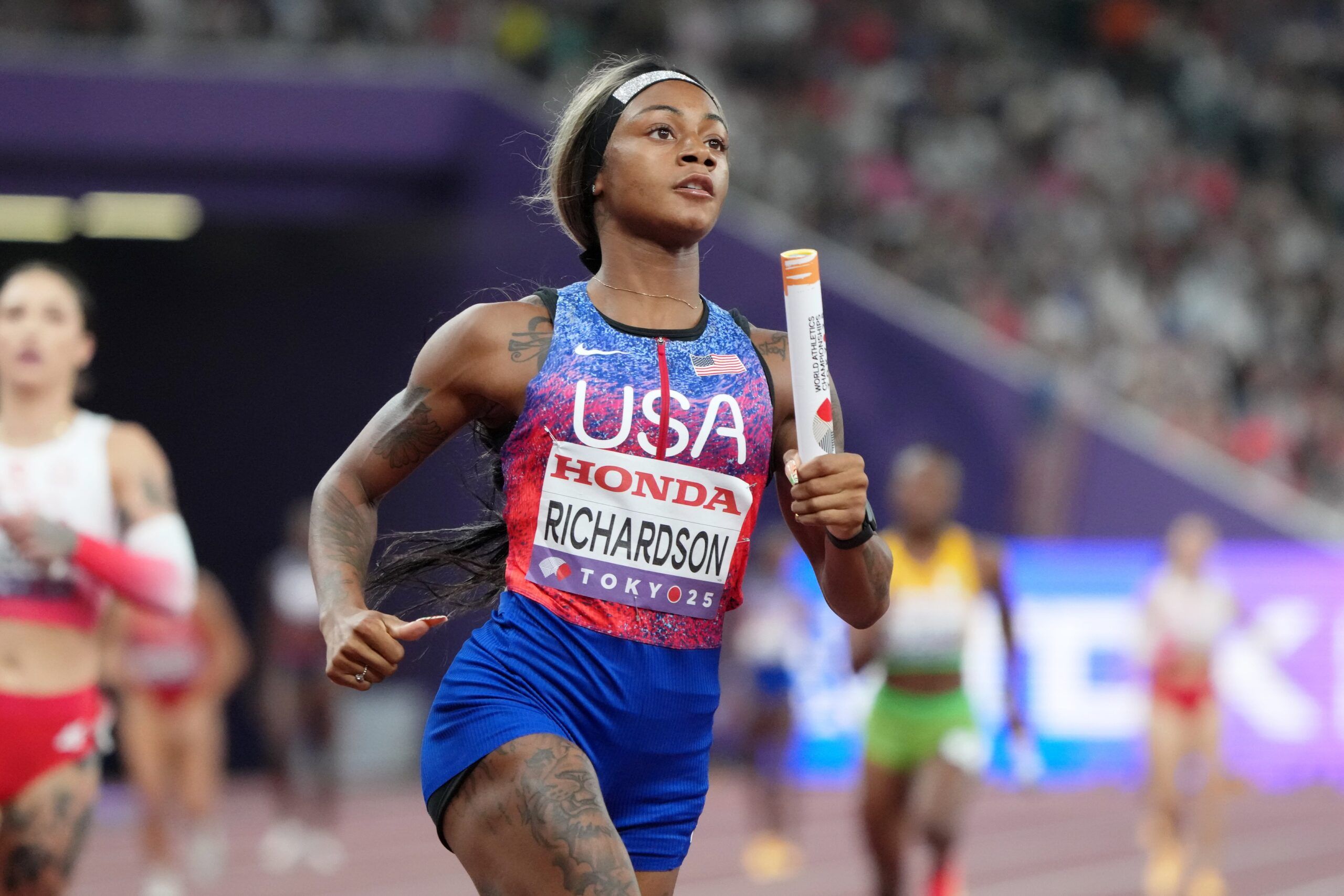 Sha'Carri Richardson (USA) competes in a womens 4x100m relay heat at National Stadium.