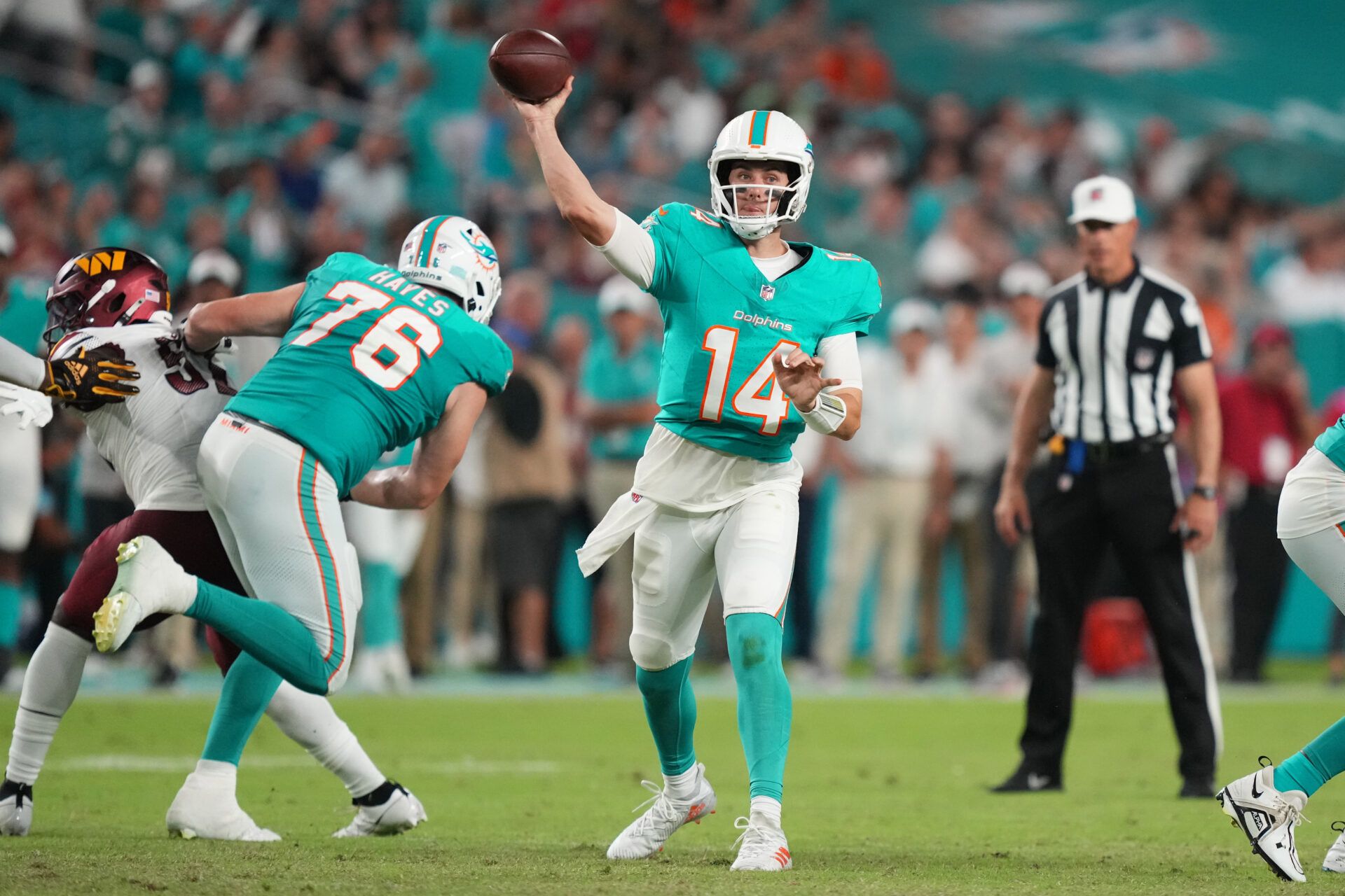 Miami Dolphins quarterback Mike White (14) drops back to pass against the Washington Commanders during the fourth quarter at Hard Rock Stadium.